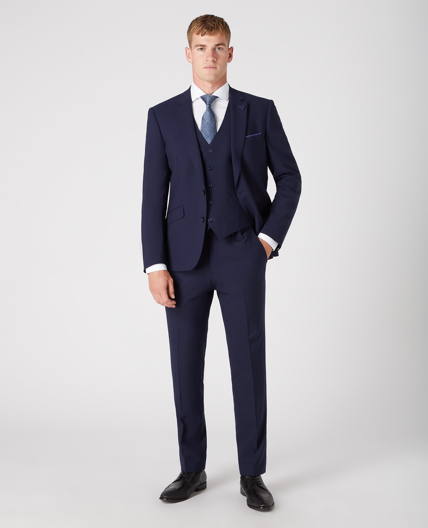Man wearing a navy Tapered Fit Wool-Rich Stretch Mix and Match