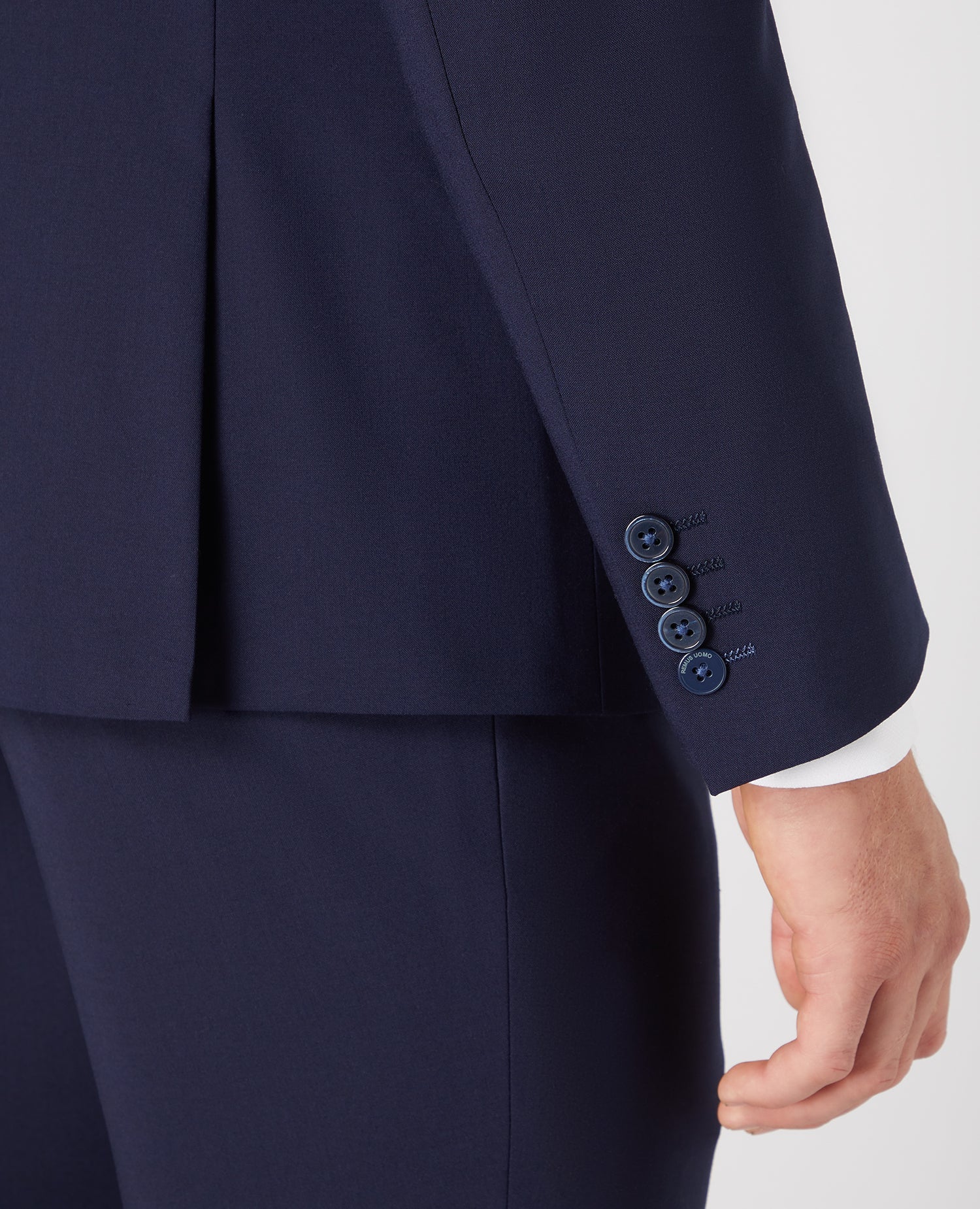 Man wearing a navy Tapered Fit Wool-Rich Stretch Mix and Match