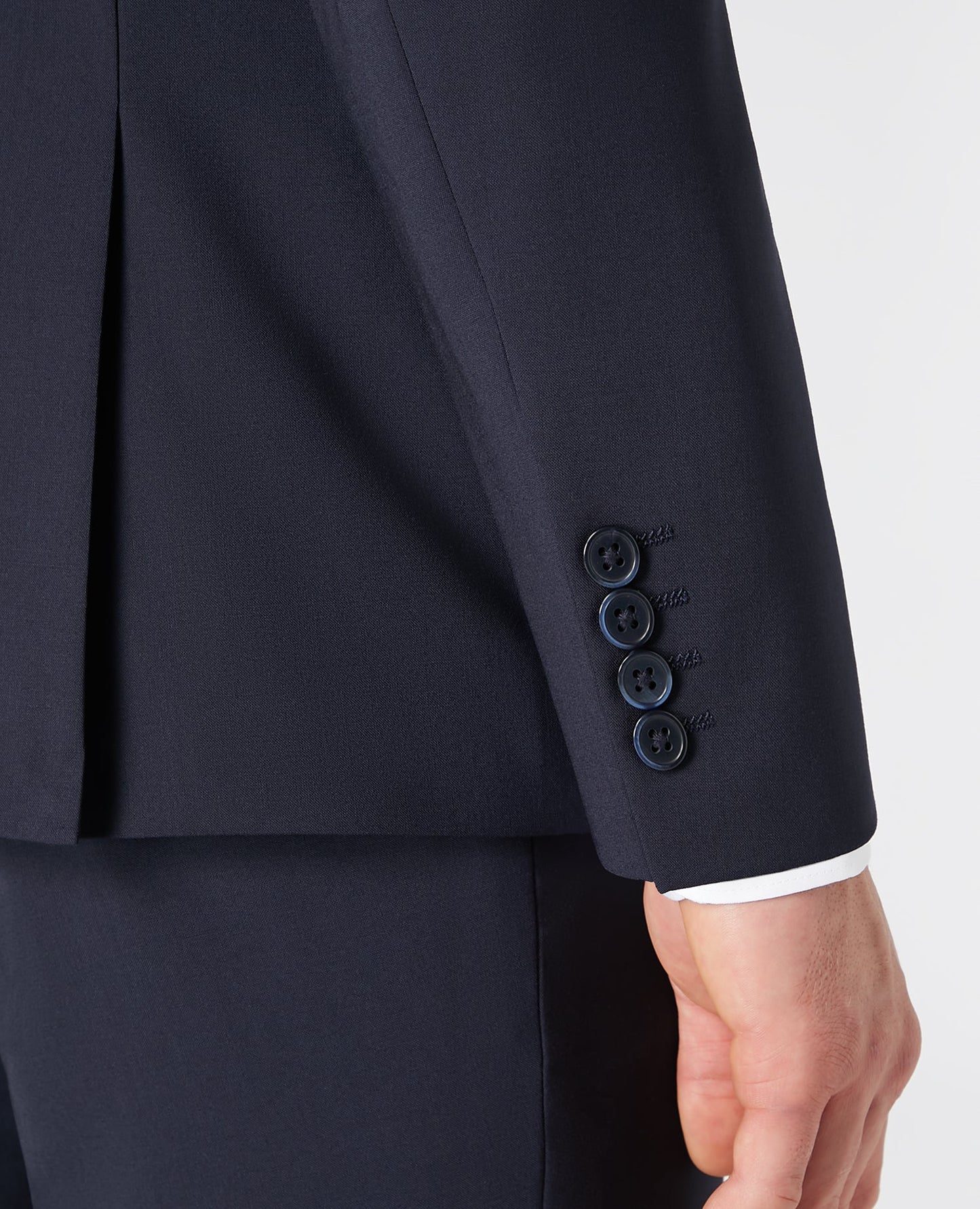 Man wearing a navy Tapered fit wool blend stretch mix and match suit jacket