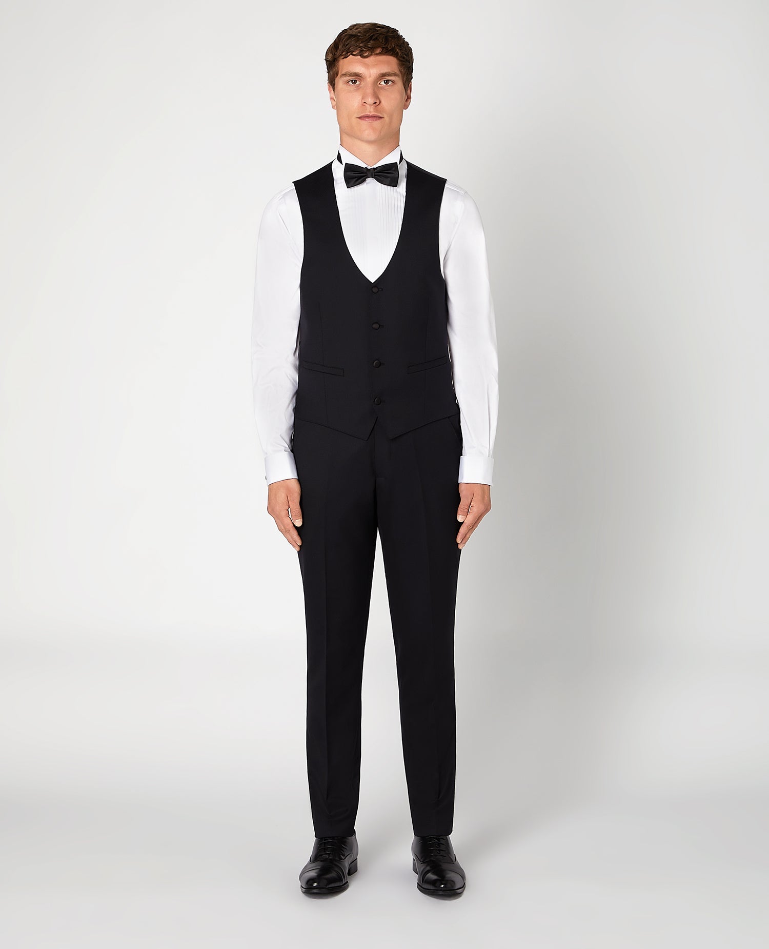 Man wearing a black Slim Fit Wool-Rich Mix and Match Waistcoat