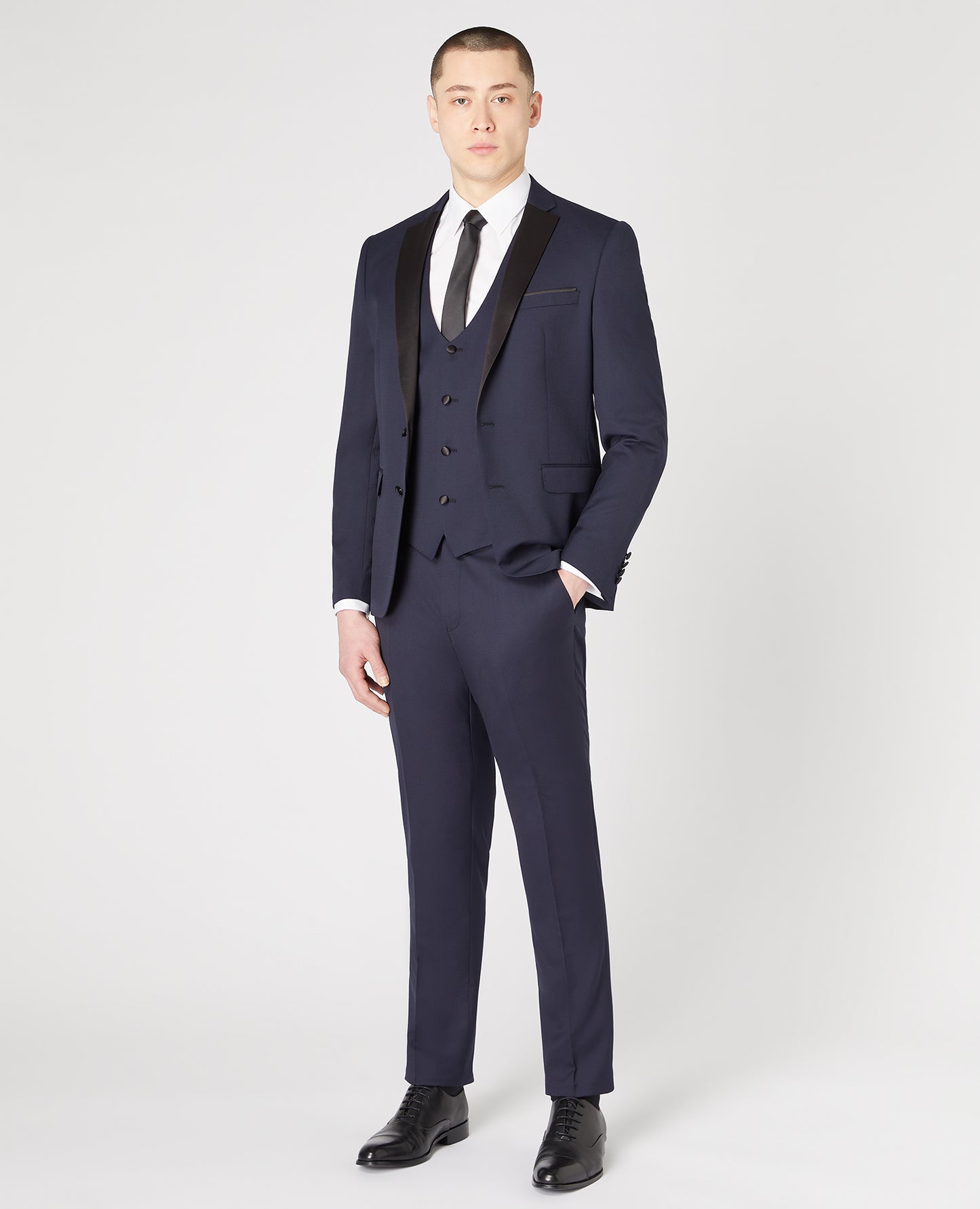 Man wearing a navy Slim Fit Wool-Rich Mix and Match Waistcoat