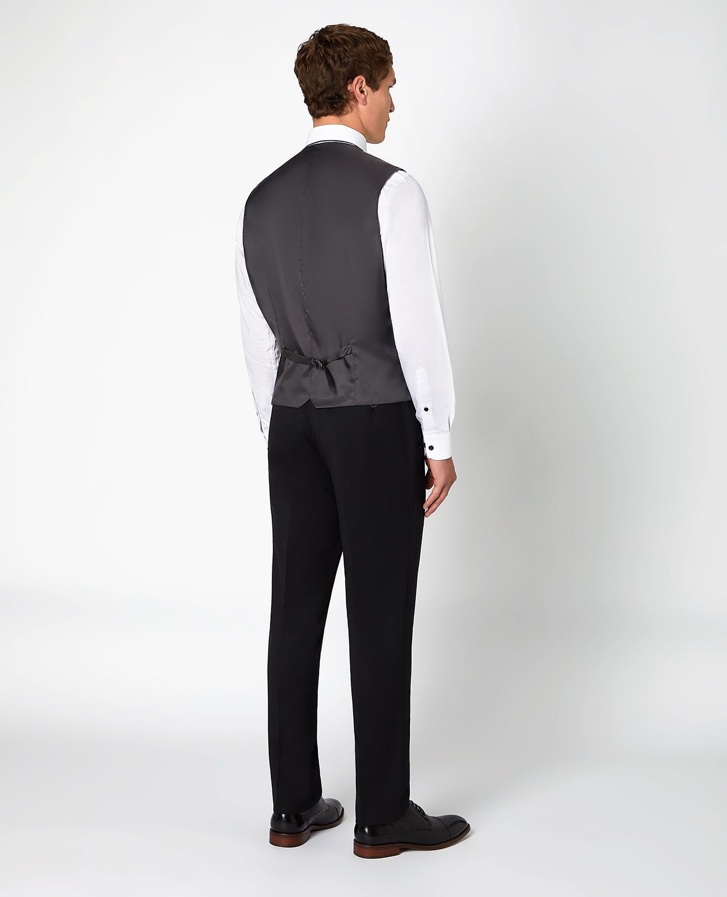 Man wearing a black Tapered Fit Wool-Blend Stretch Mix and Match Suit Waistcoat