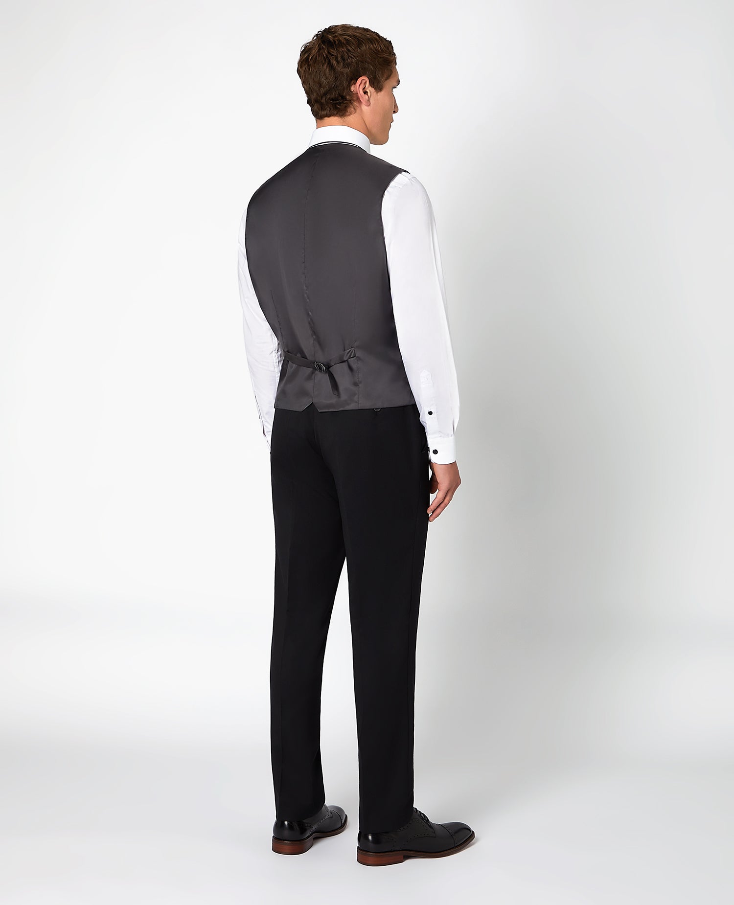 Man wearing a black Tapered Fit Wool-Blend Stretch Mix and Match Suit Waistcoat