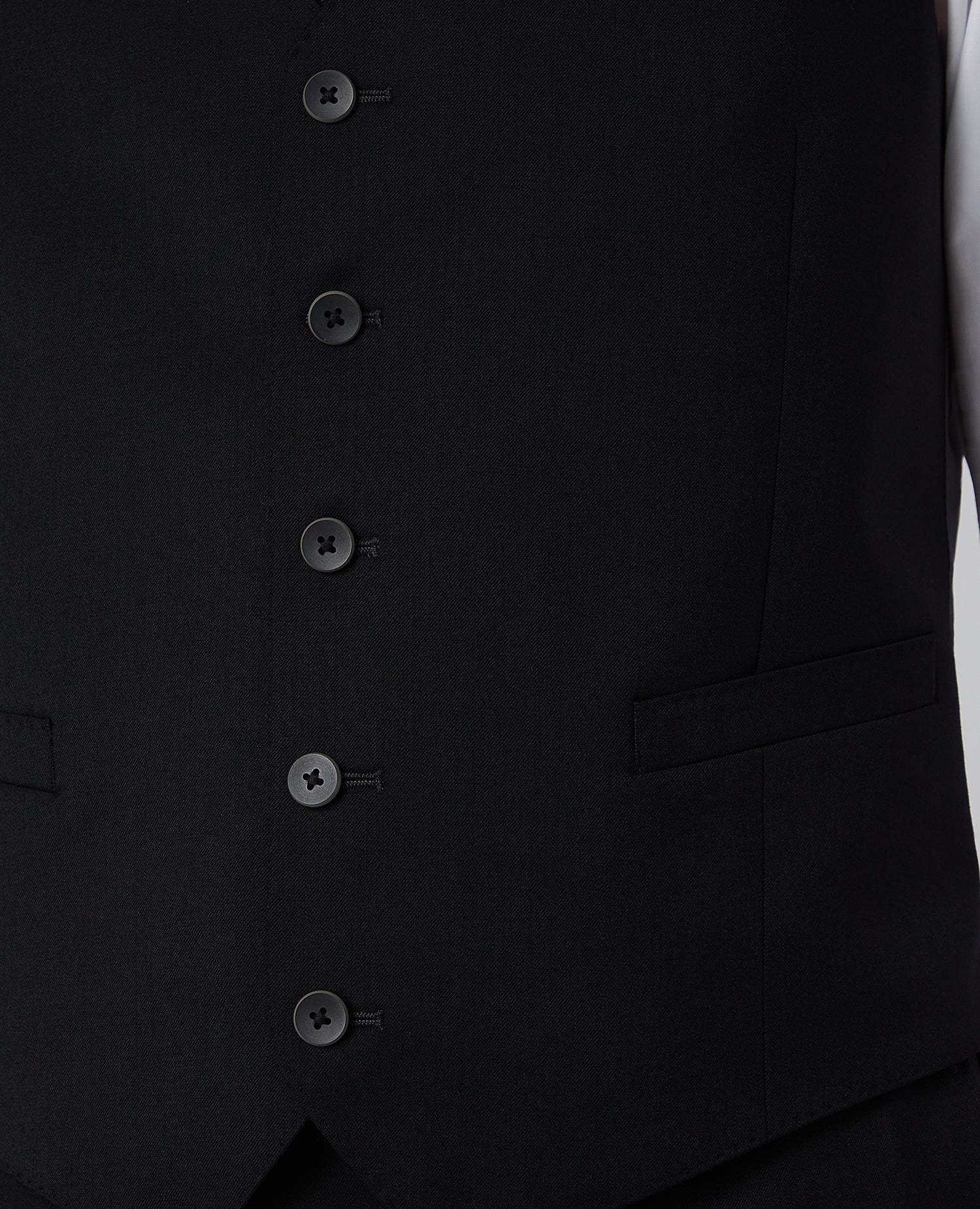 Man wearing a black Tapered Fit Wool-Blend Stretch Mix and Match Suit Waistcoat