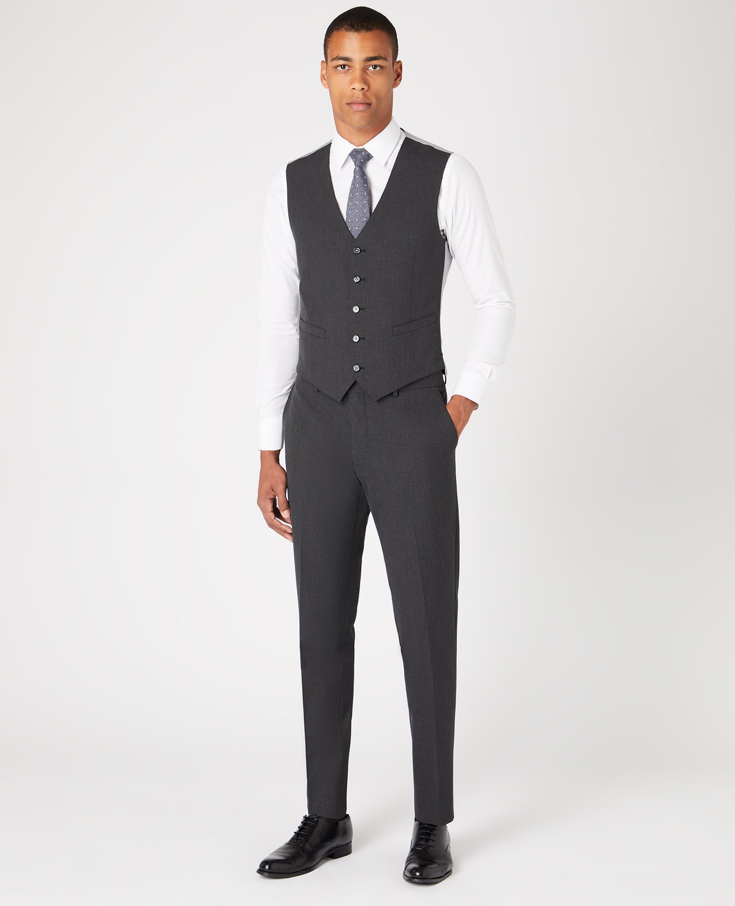 Man wearing a grey Tapered Fit Polyviscose Stretch Waistcoat