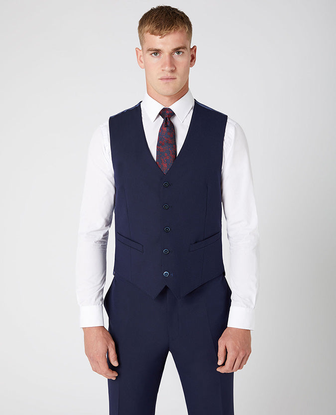Man wearing a navy Tapered Fit Stretch Waistcoat
