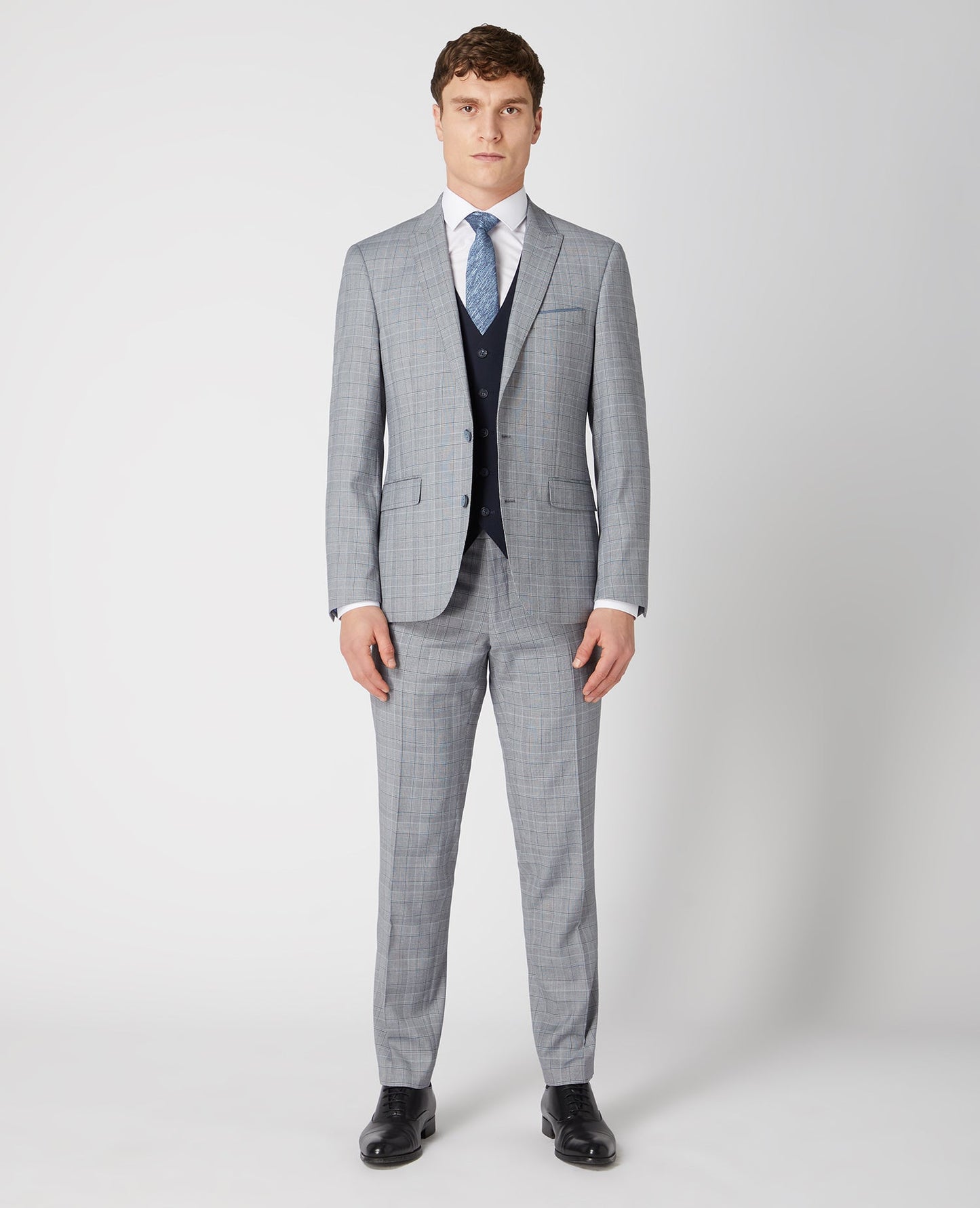 Man wearing a navy Tapered Fit Stretch Waistcoat