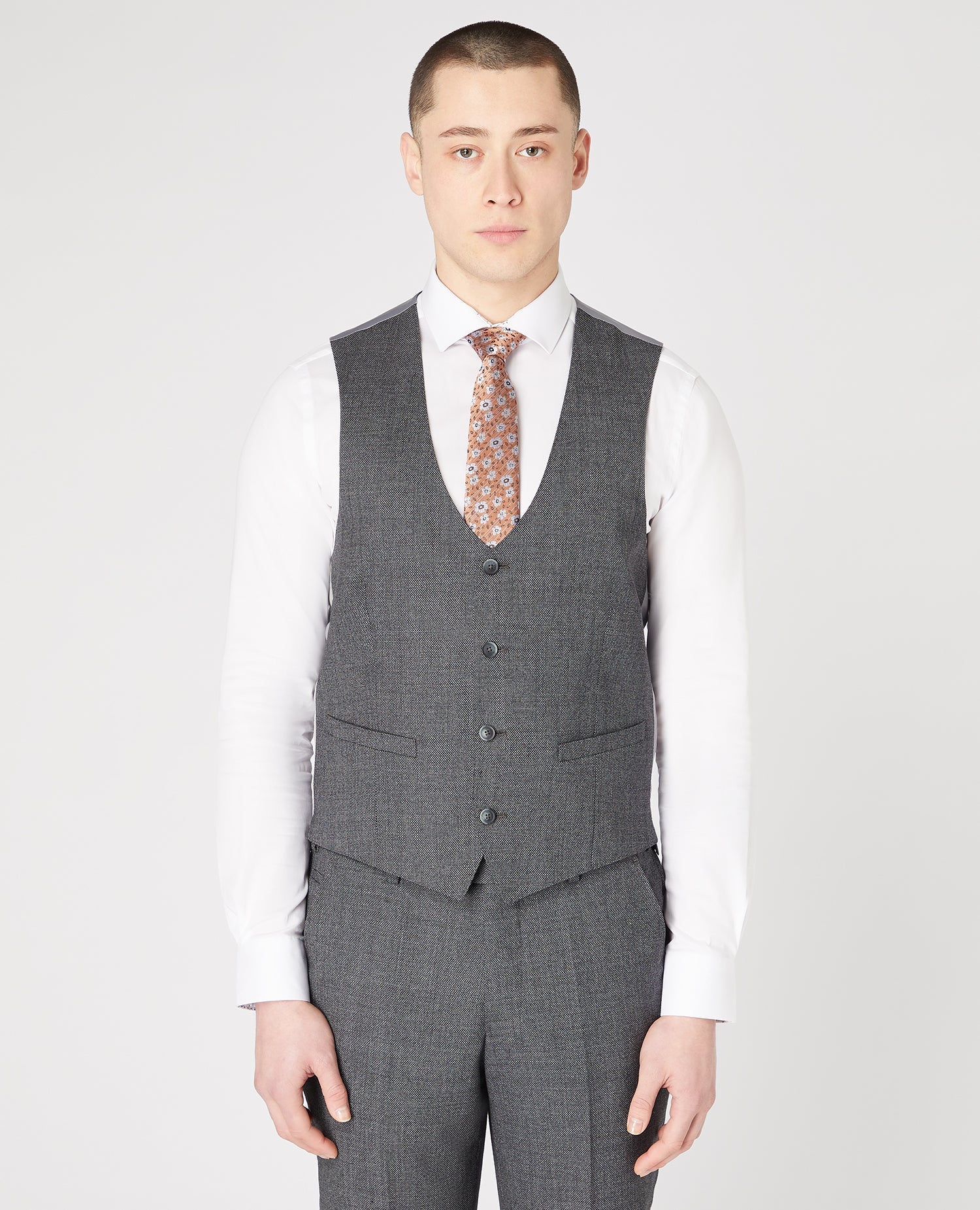 Man wearing a grey Slim Fit Wool-Rich Mix and Match Suit Waistcoat