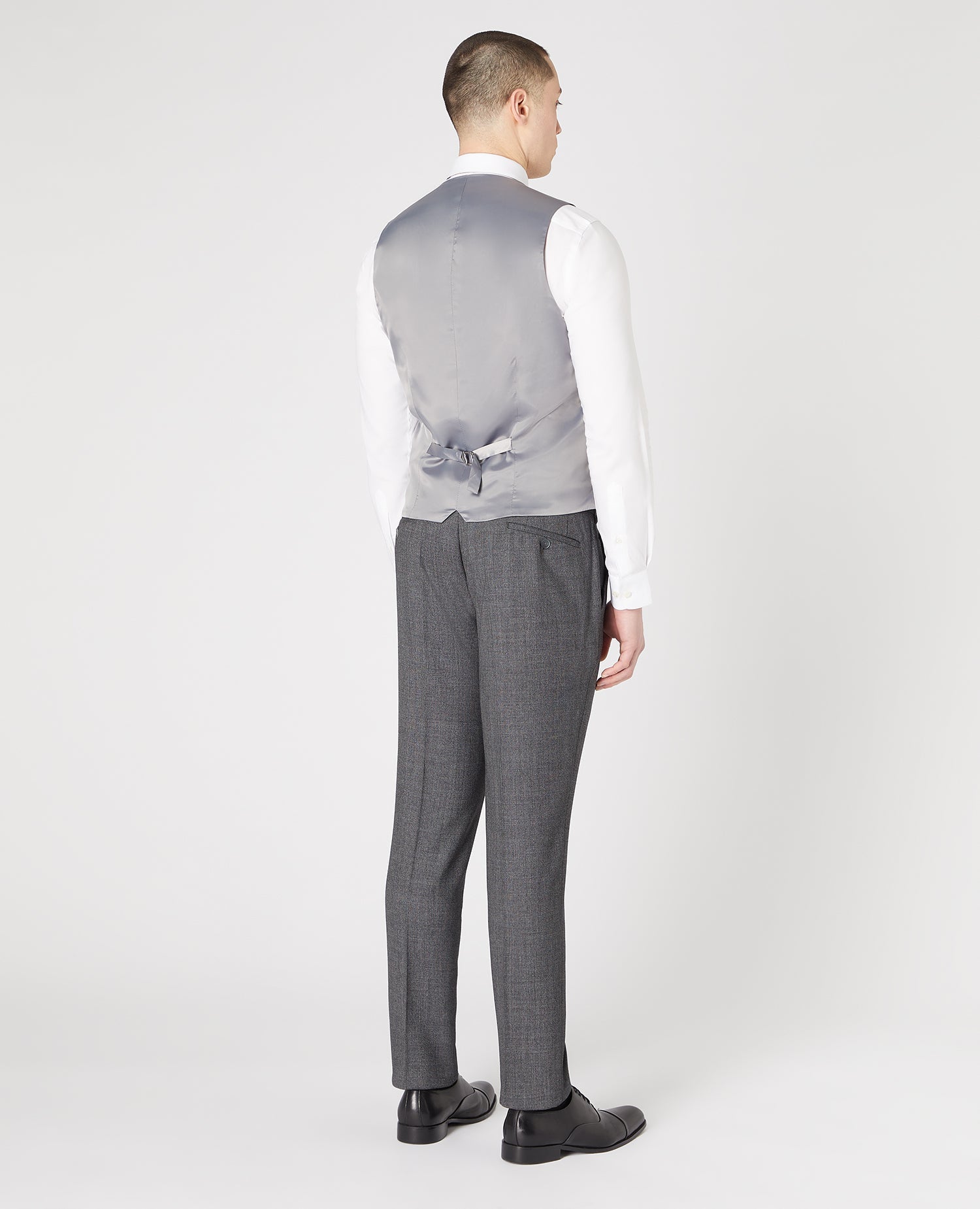 Man wearing a grey Slim Fit Wool-Rich Mix and Match Suit Waistcoat