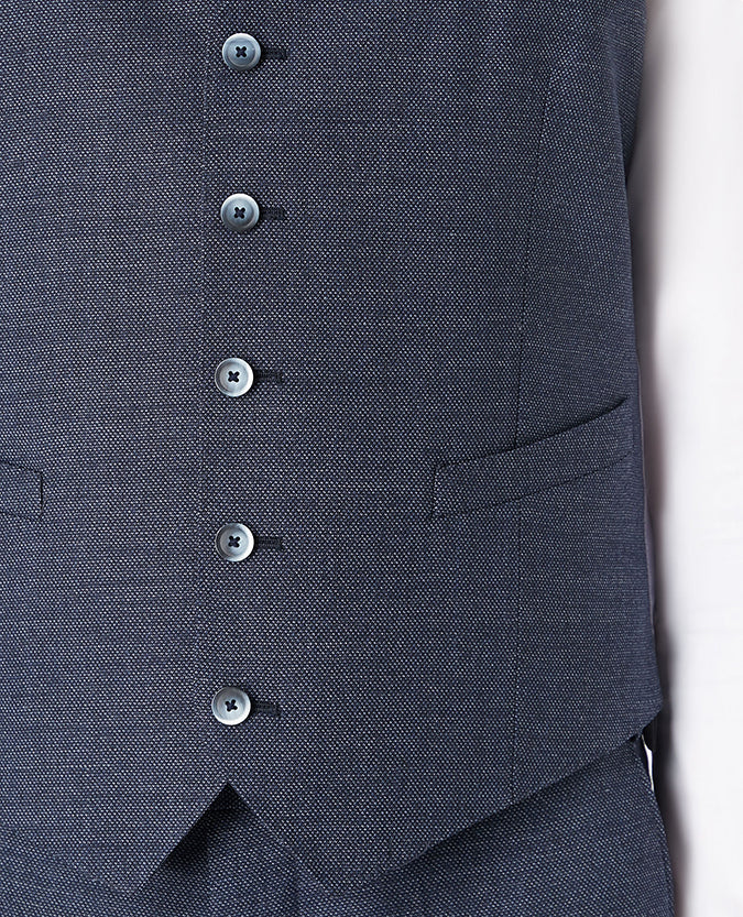Man wearing a blue Tapered Fit Wool-Rich Mix and Match Suit Waistcoat