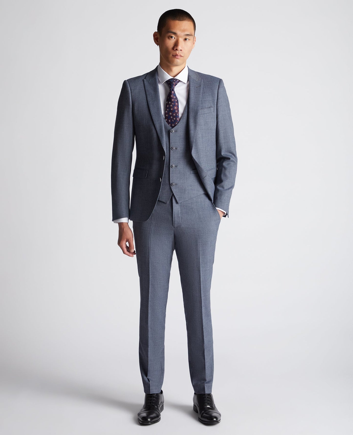 Man wearing a blue X-Slim Fit Wool Blend Mix And Match Suit Waistcoat