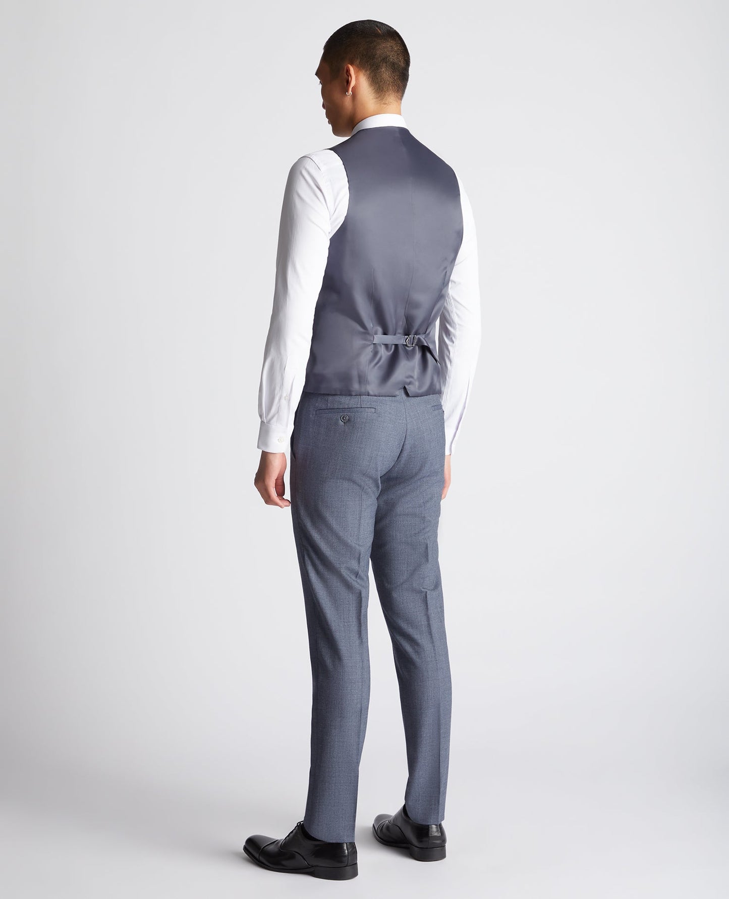 Man wearing a blue X-Slim Fit Wool Blend Mix And Match Suit Waistcoat