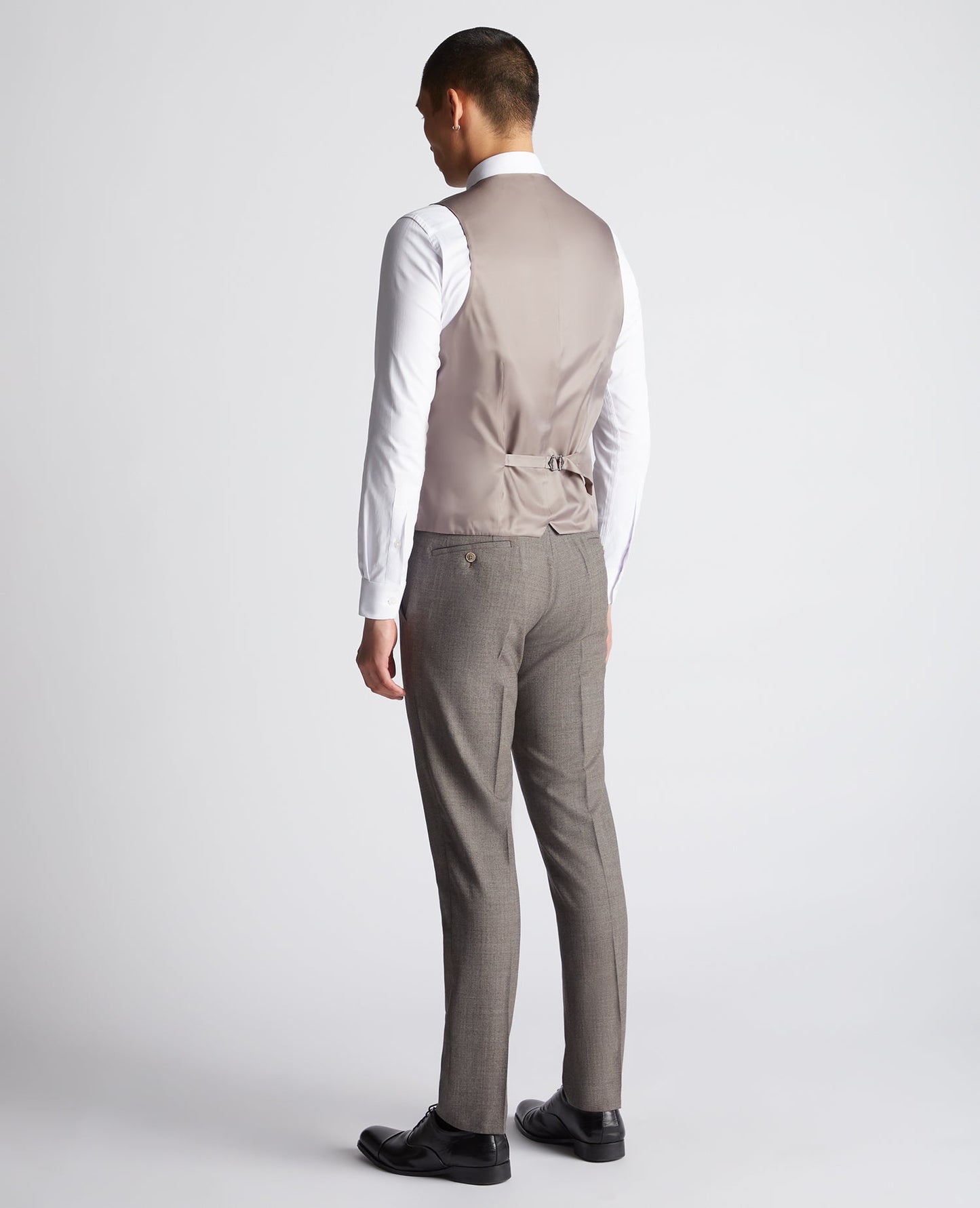 Man wearing a brown X-Slim Fit Wool Blend Mix And Match Suit Waistcoat