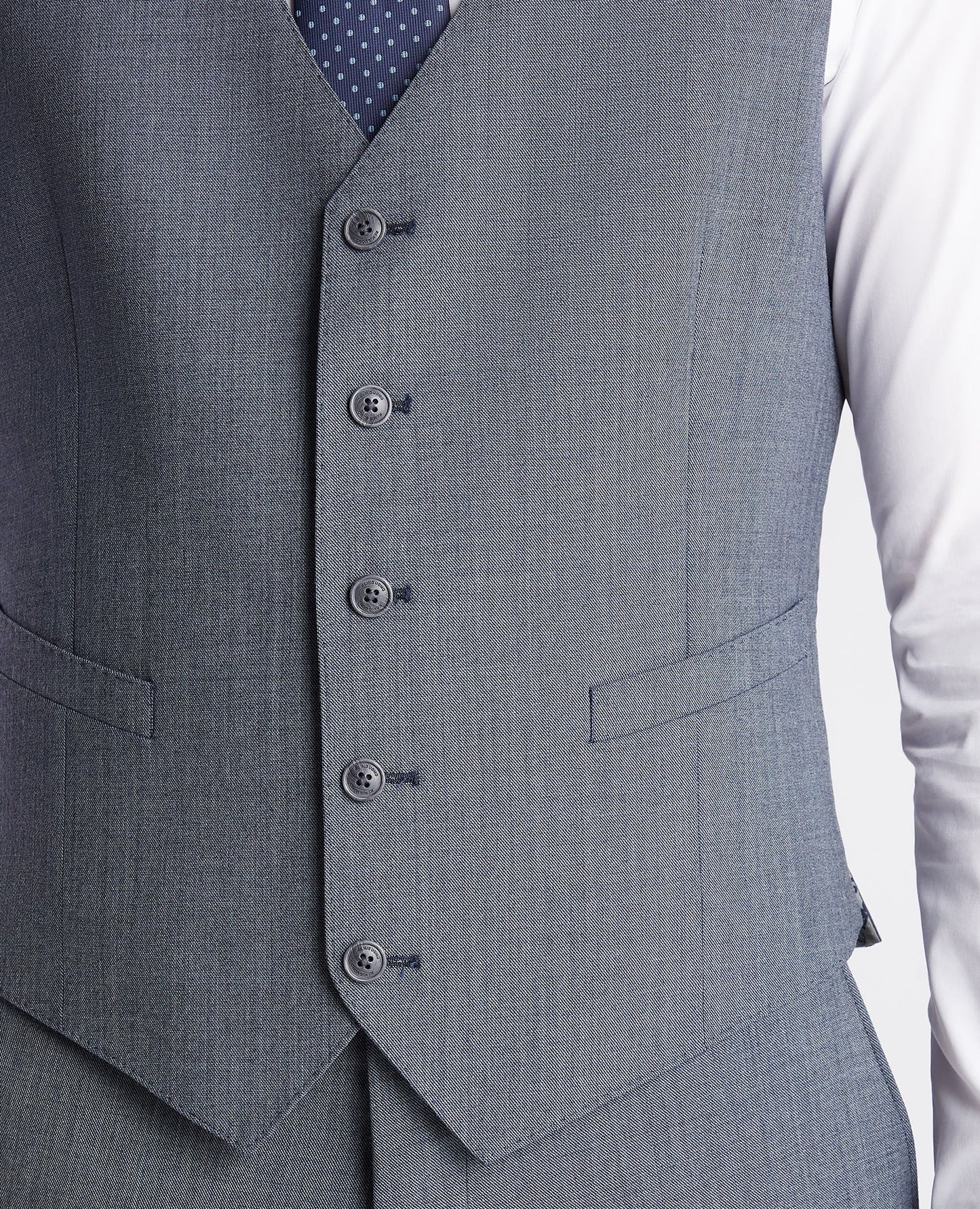 Man wearing a blue Tapered fit wool blend mix and match suit waistcoat
