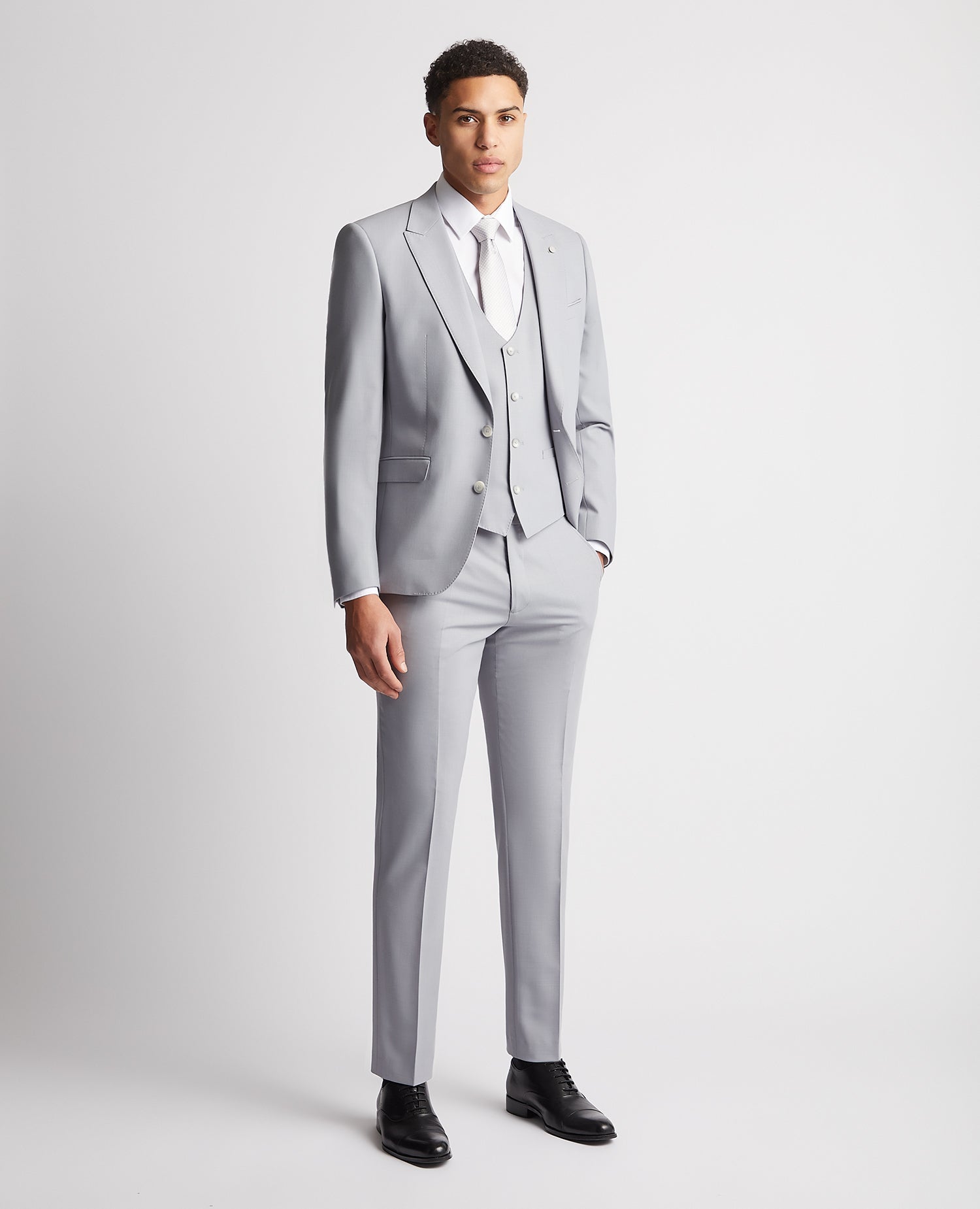 Man wearing a blue Slim Fit Wool Rich Mix and Match Waistcoat