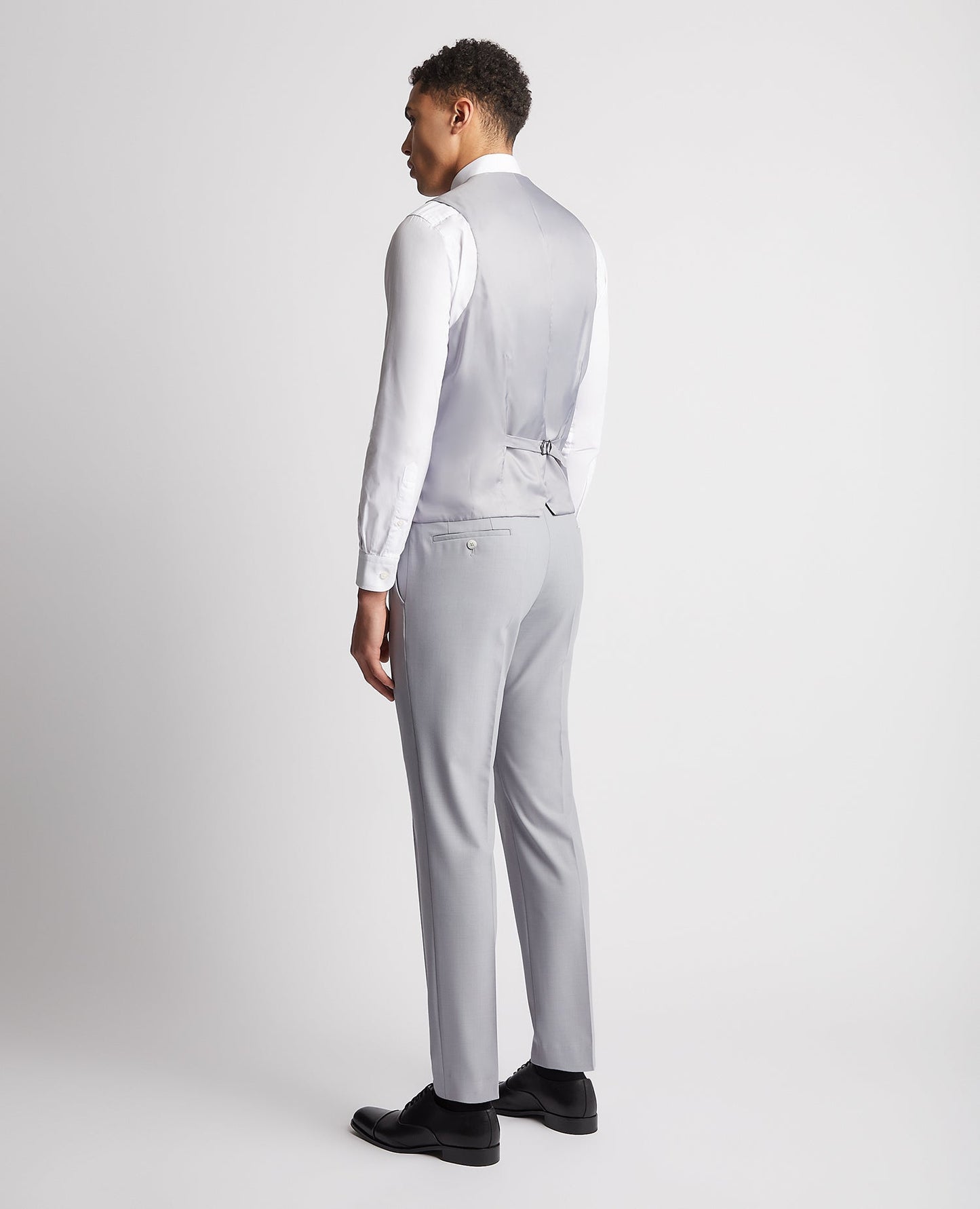 Man wearing a blue Slim Fit Wool Rich Mix and Match Waistcoat