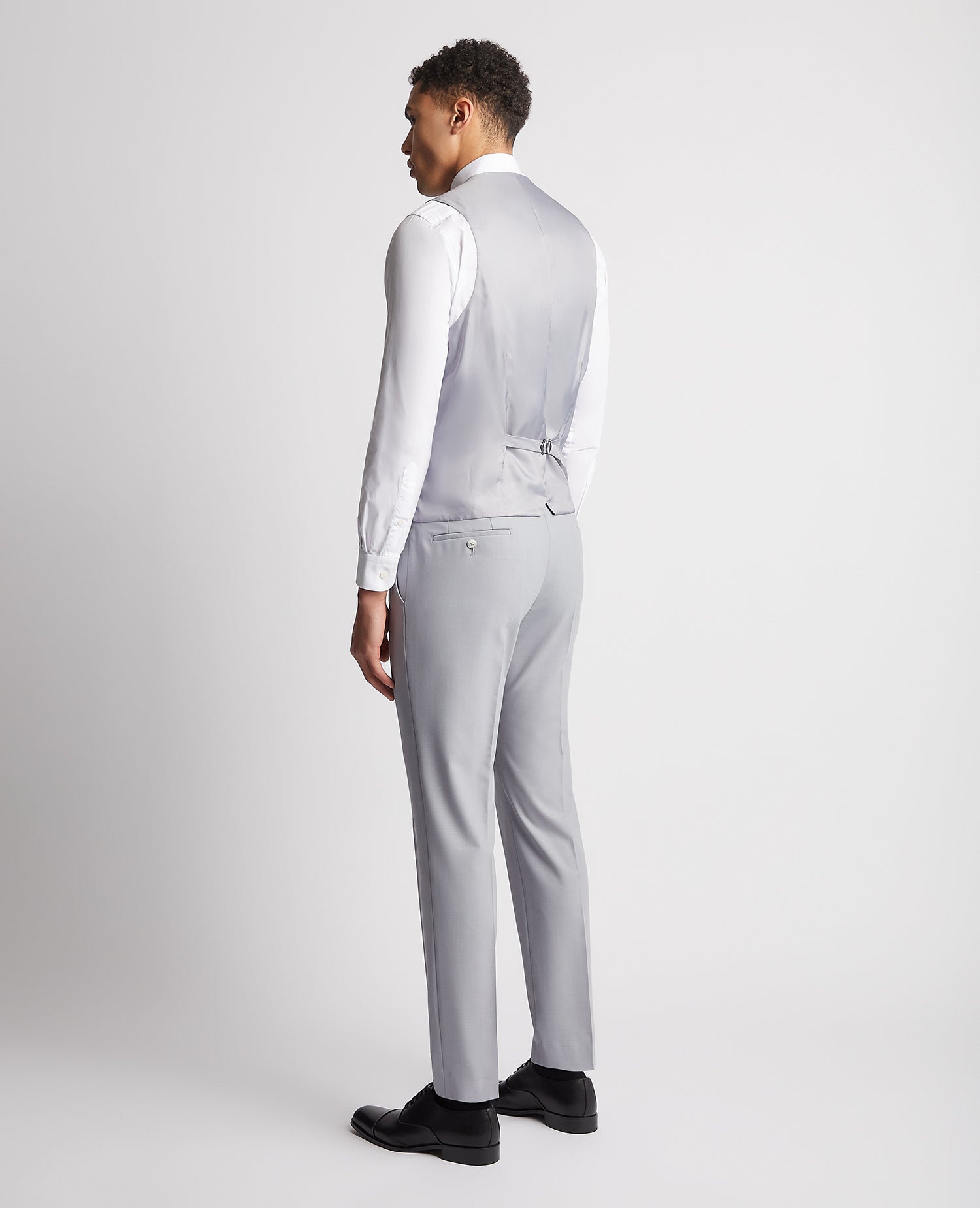 Man wearing a blue Slim Fit Wool Rich Mix and Match Waistcoat