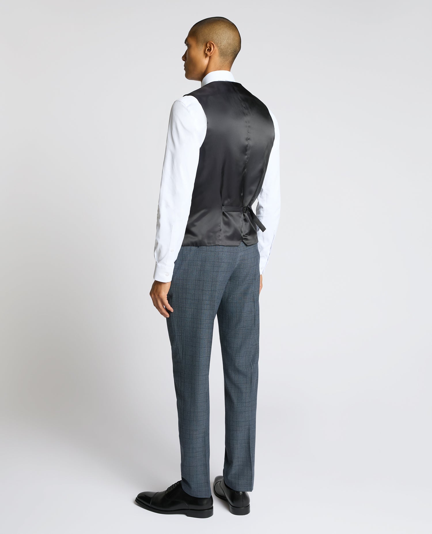 Man wearing a blue Slim Fit Check Waistcoat