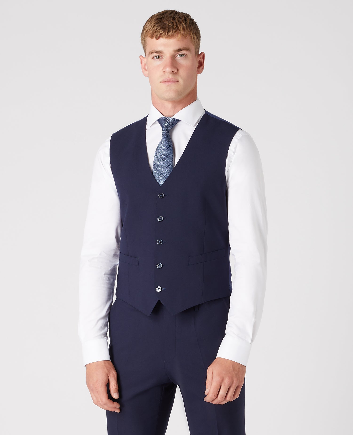 Man wearing a navy Tapered Fit Wool-Rich Mix and Match Waistcoat