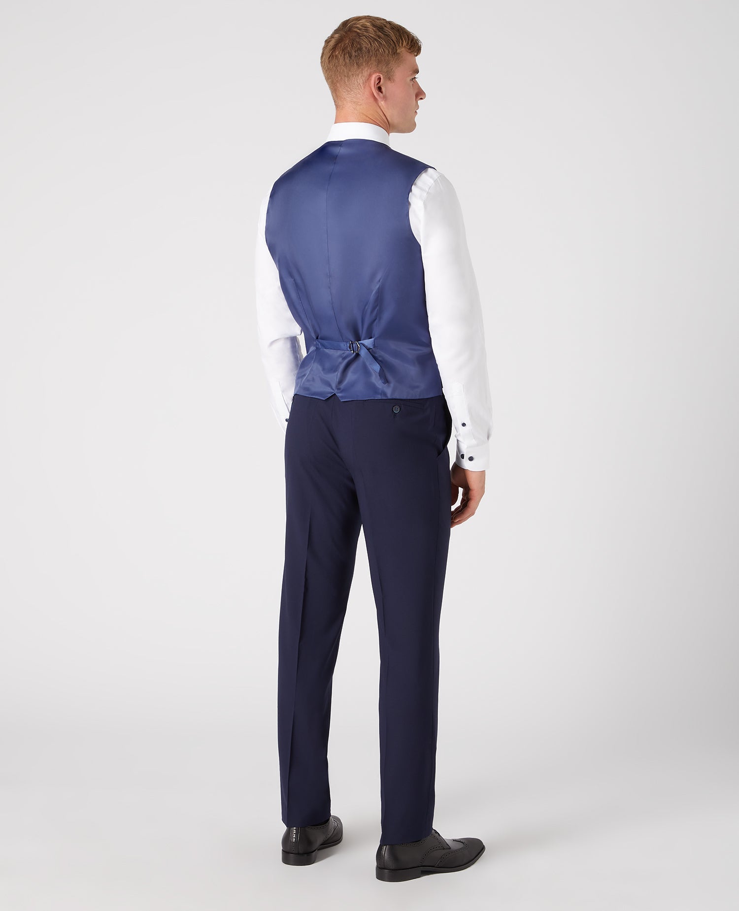 Man wearing a navy Tapered Fit Wool-Rich Mix and Match Waistcoat