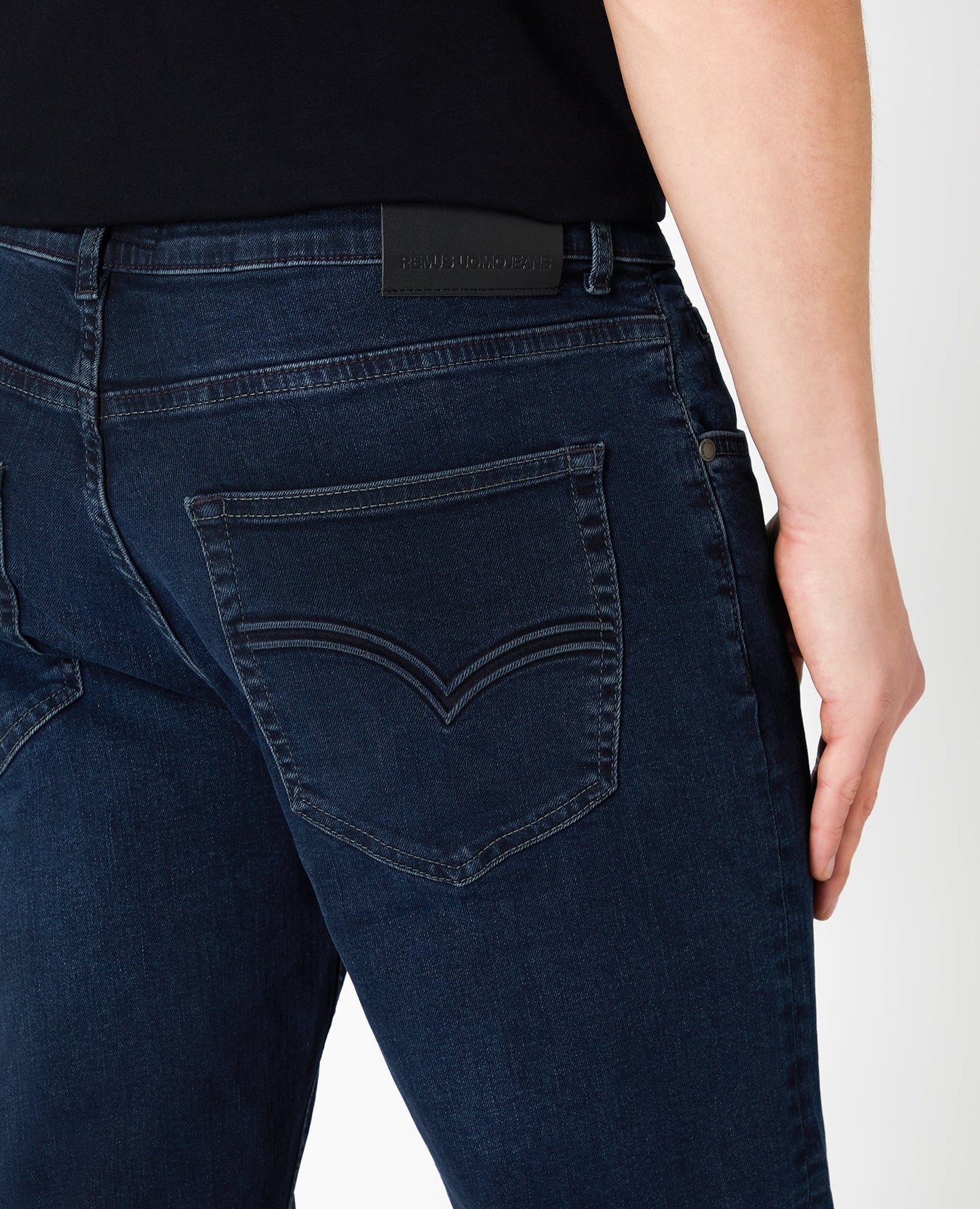 Man wearing a blue Ramsey Straight Leg Cotton-Stretch Jeans