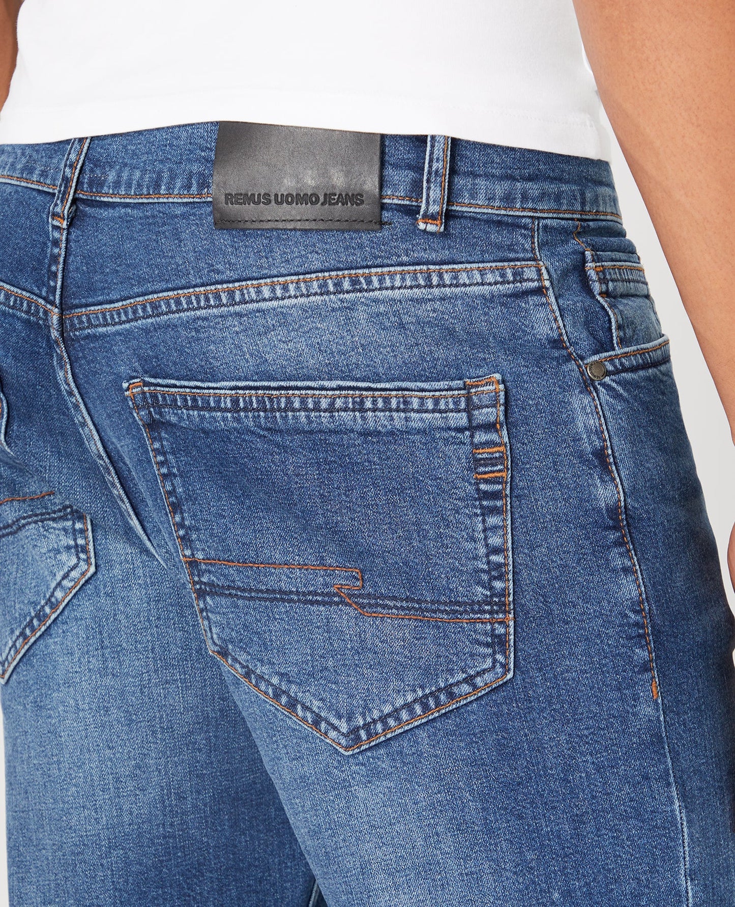 Man wearing a blue Straight Leg Cotton-Stretch Jeans