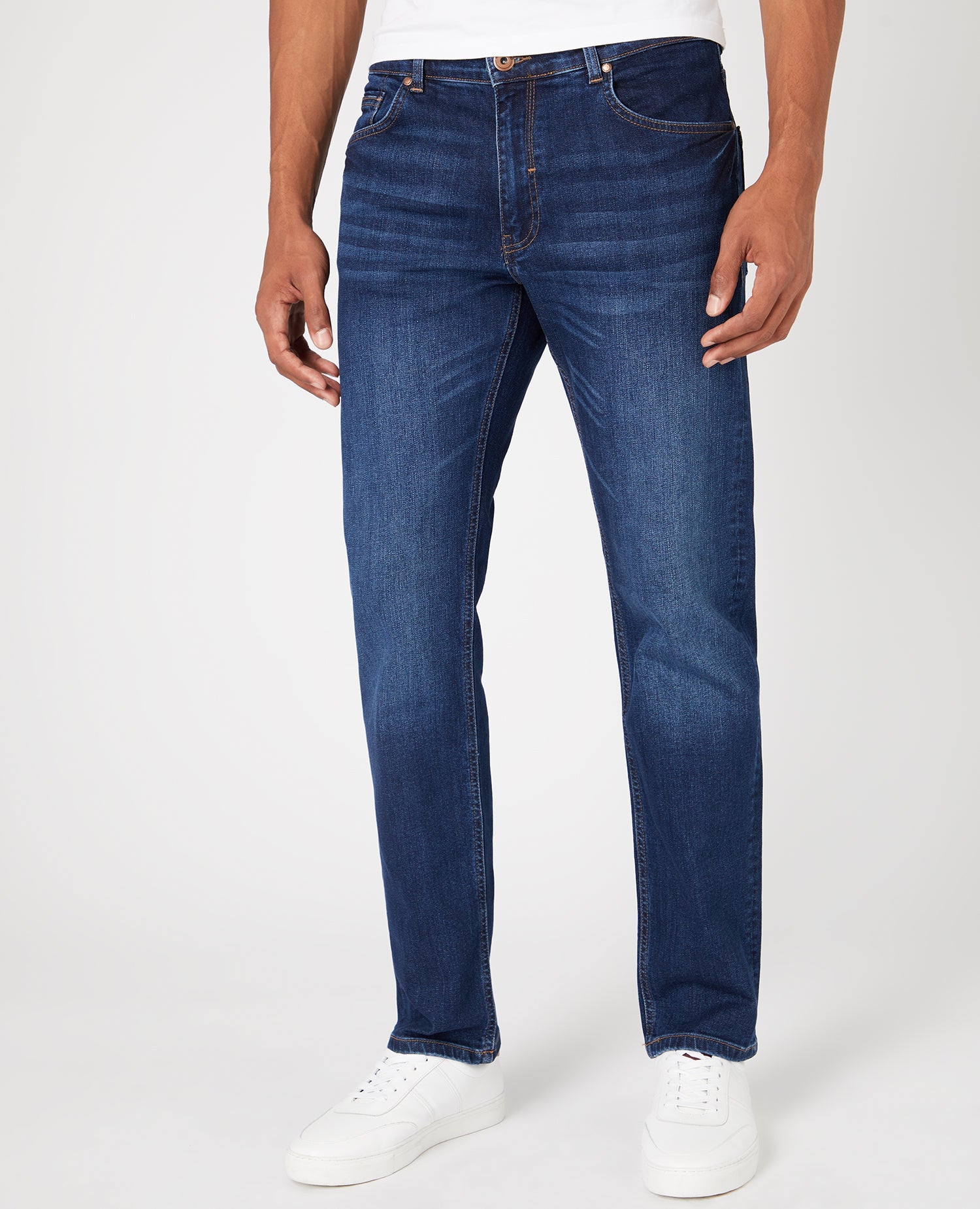 Man wearing a navy Straight Leg Cotton-Stretch Jeans