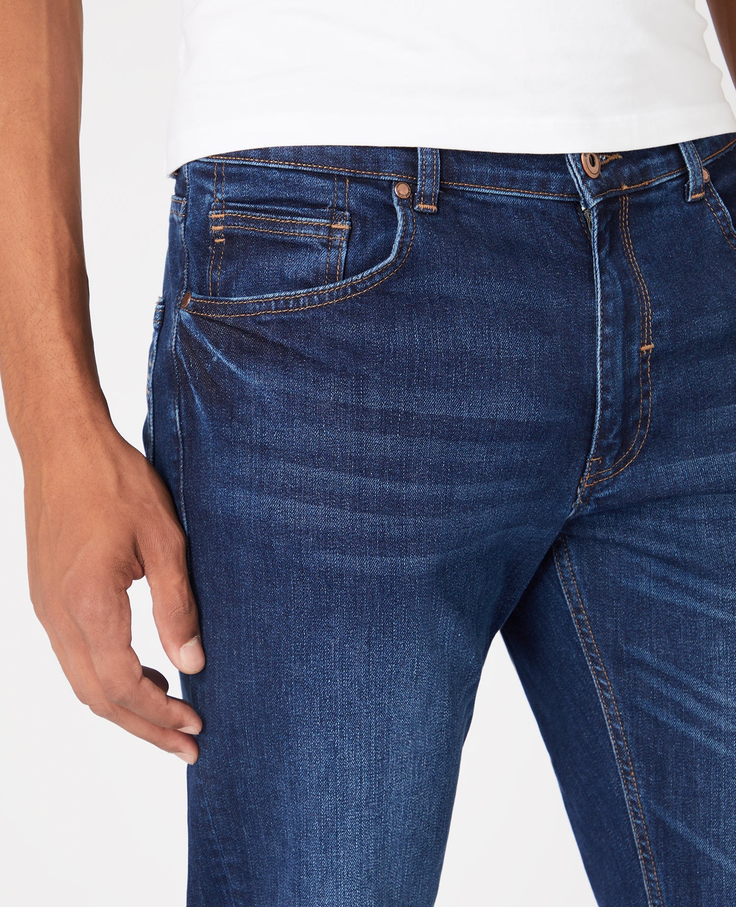 Man wearing a navy Straight Leg Cotton-Stretch Jeans