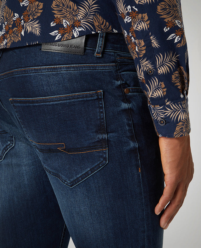 Man wearing a blue Slim Leg Cotton Power Stretch Jean