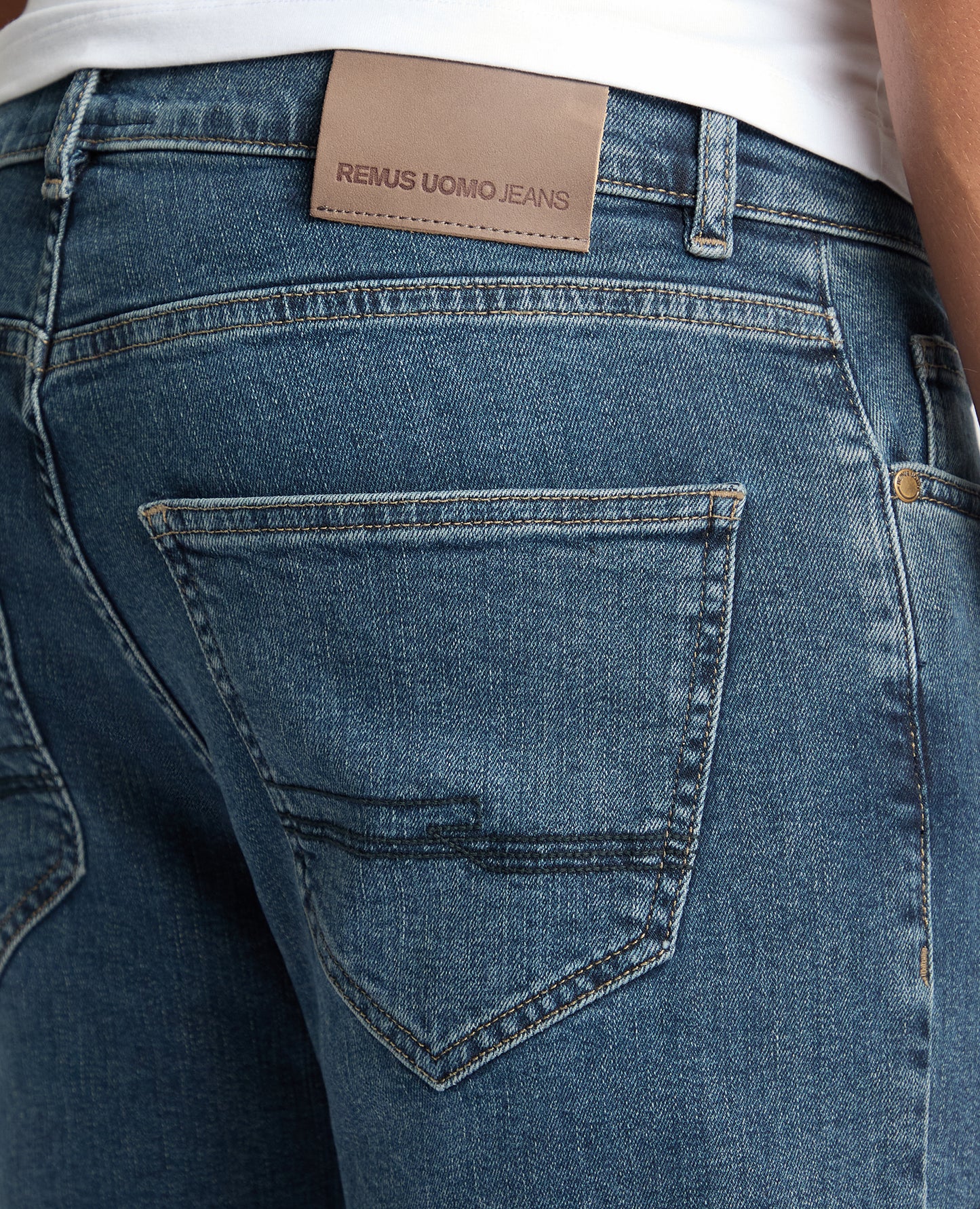 Man wearing a blue Roman Modern Straight Fit Cotton-Stretch Jean