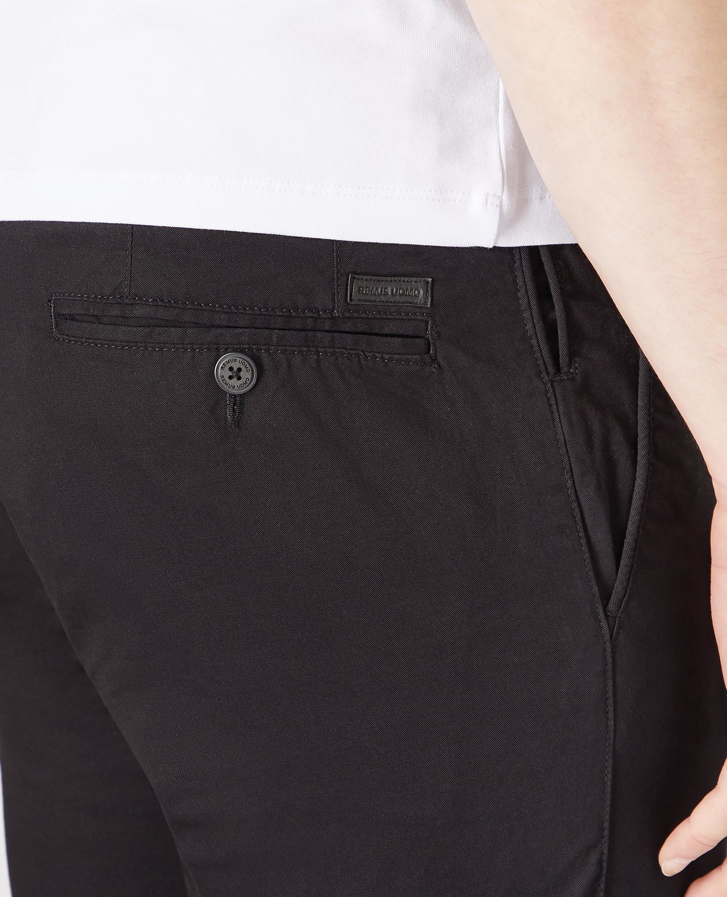 Man wearing a black Slim Leg Cotton-Stretch Chinos