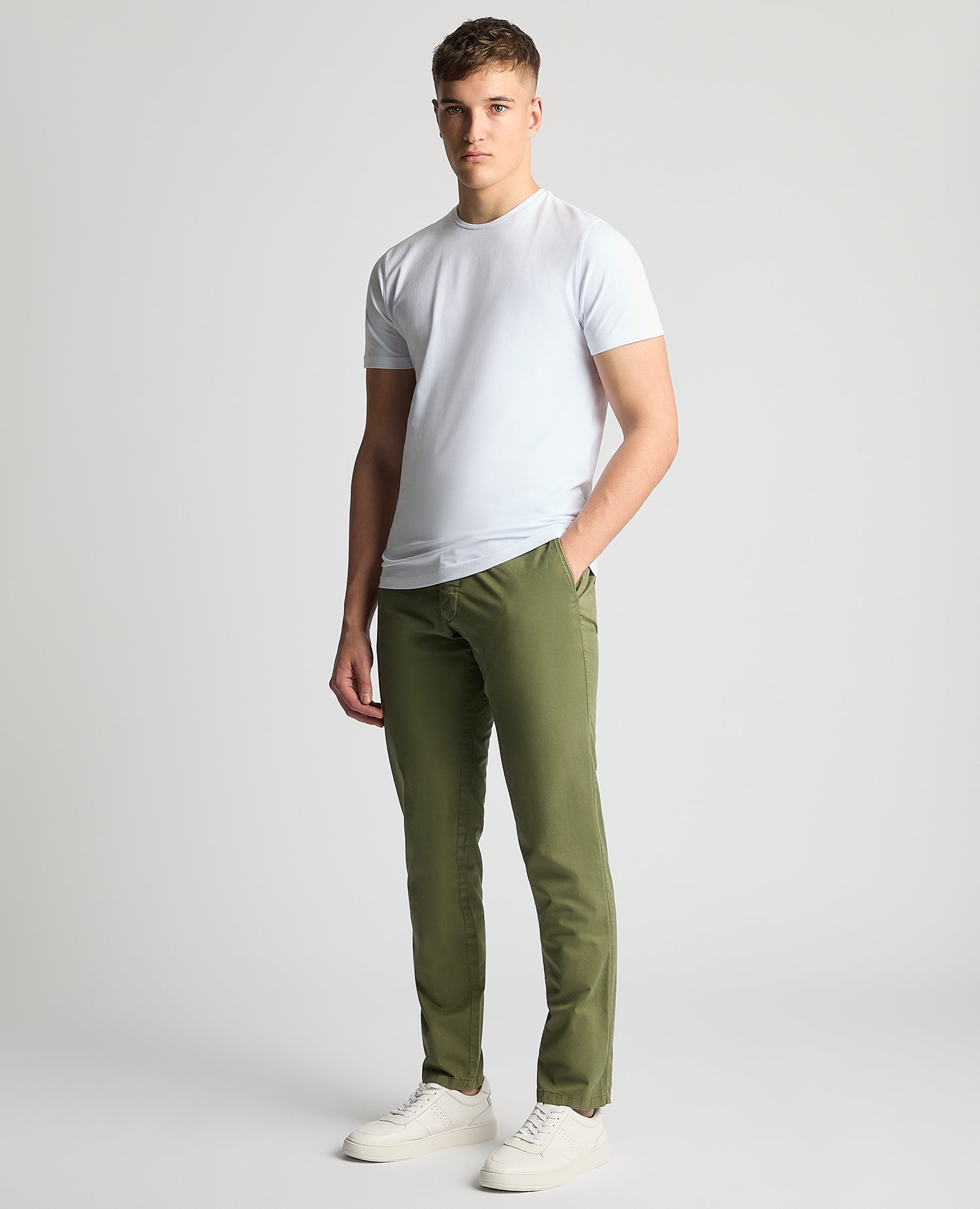 Man wearing a green Slim Leg Cotton-Stretch Chinos