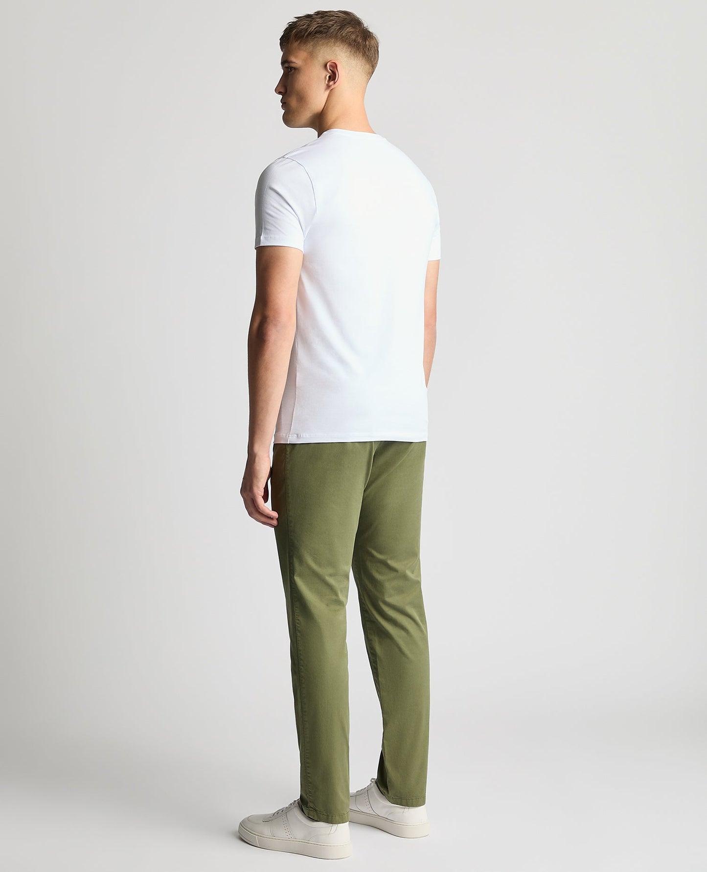 Man wearing a green Slim Leg Cotton-Stretch Chinos