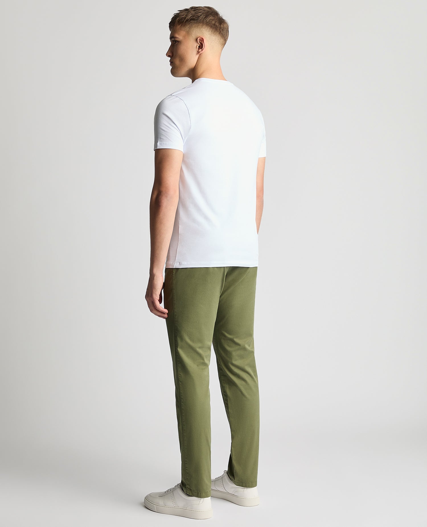 Man wearing a green Slim Leg Cotton-Stretch Chinos