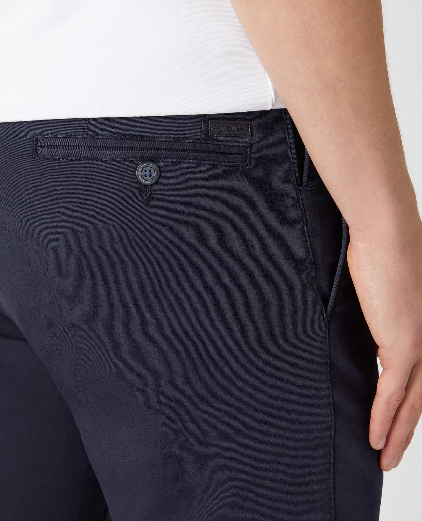 Man wearing a navy Slim Leg Cotton Stretch Chinos