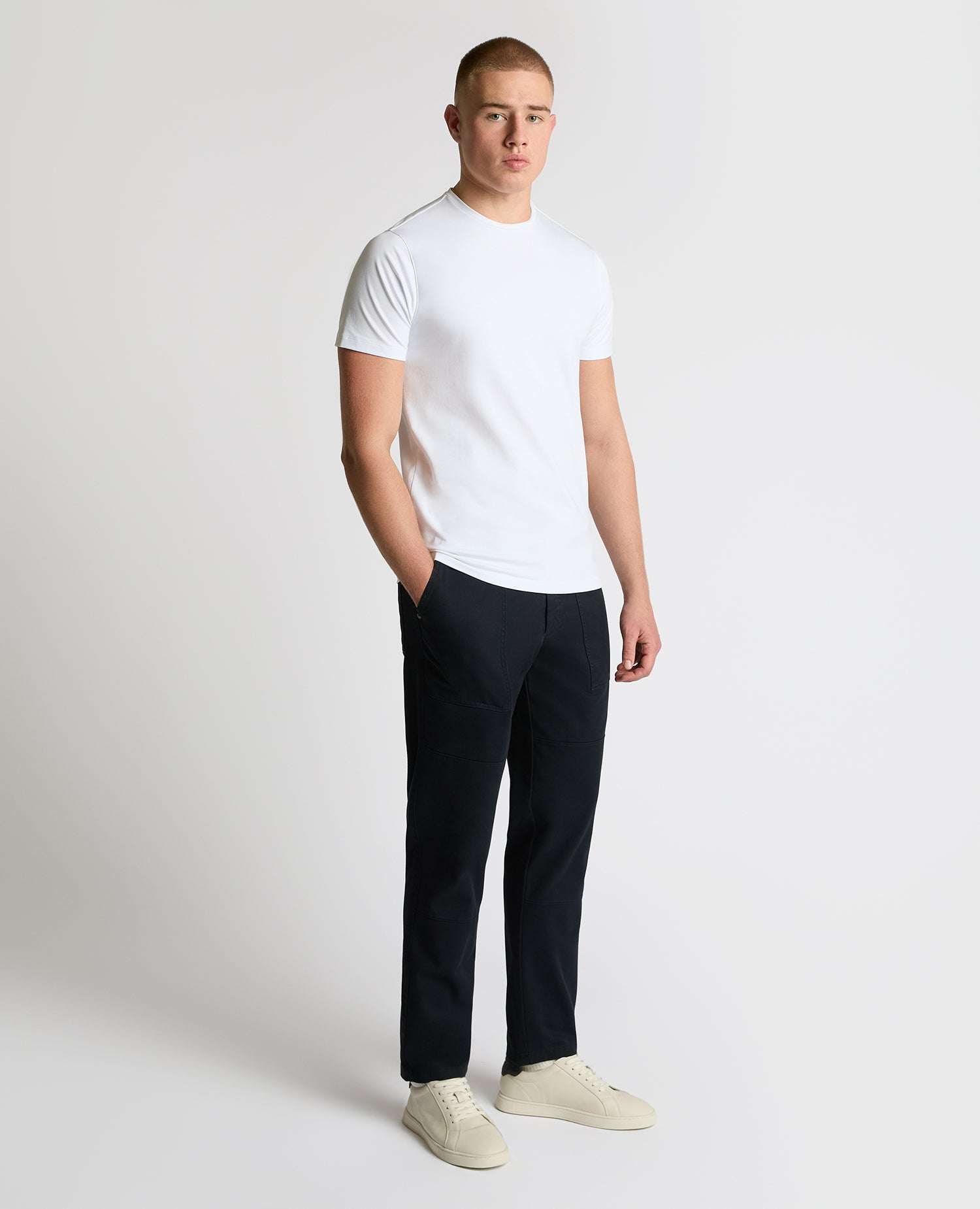 Man wearing a navy Straight Leg Cotton-Stretch Carpenter Pant