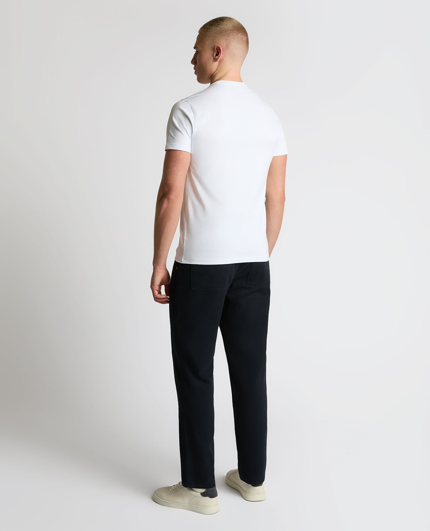 Man wearing a navy Straight Leg Cotton-Stretch Carpenter Pant