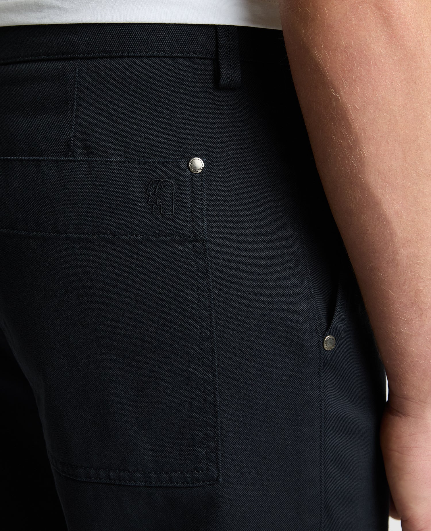 Man wearing a navy Straight Leg Cotton-Stretch Carpenter Pant