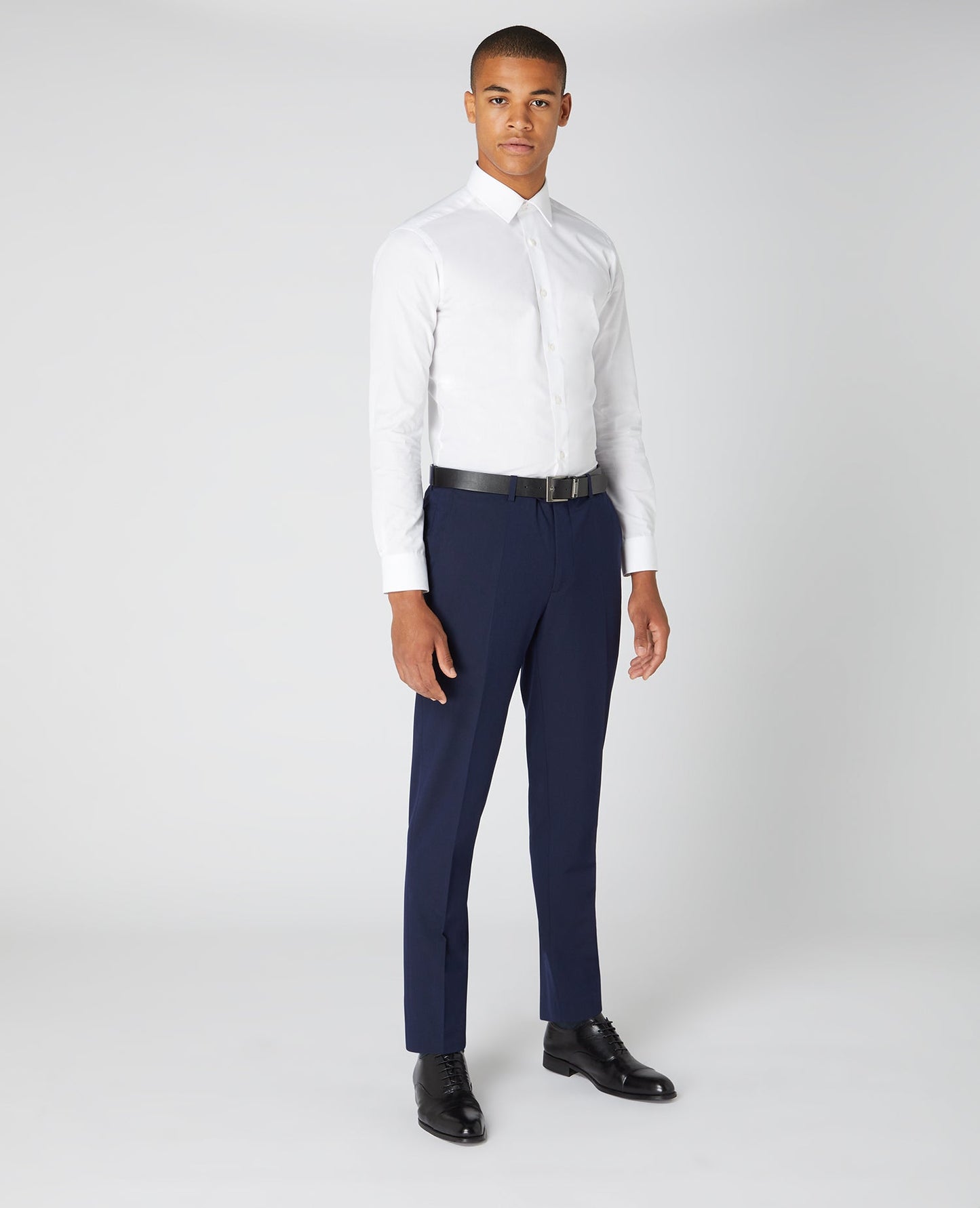 Man wearing a navy Slim Leg Formal Trousers