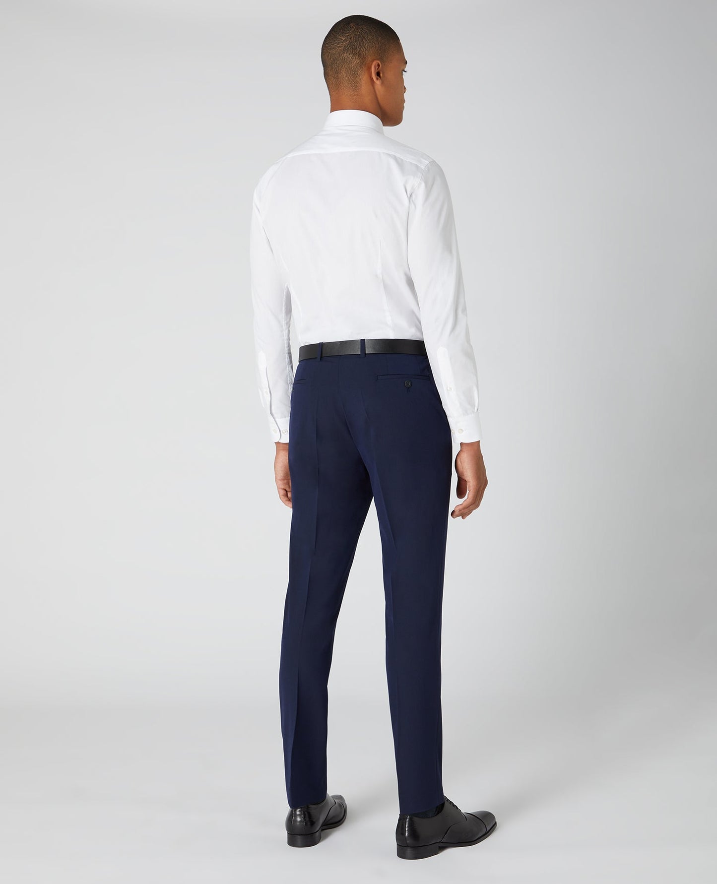 Man wearing a navy Slim Leg Formal Trousers
