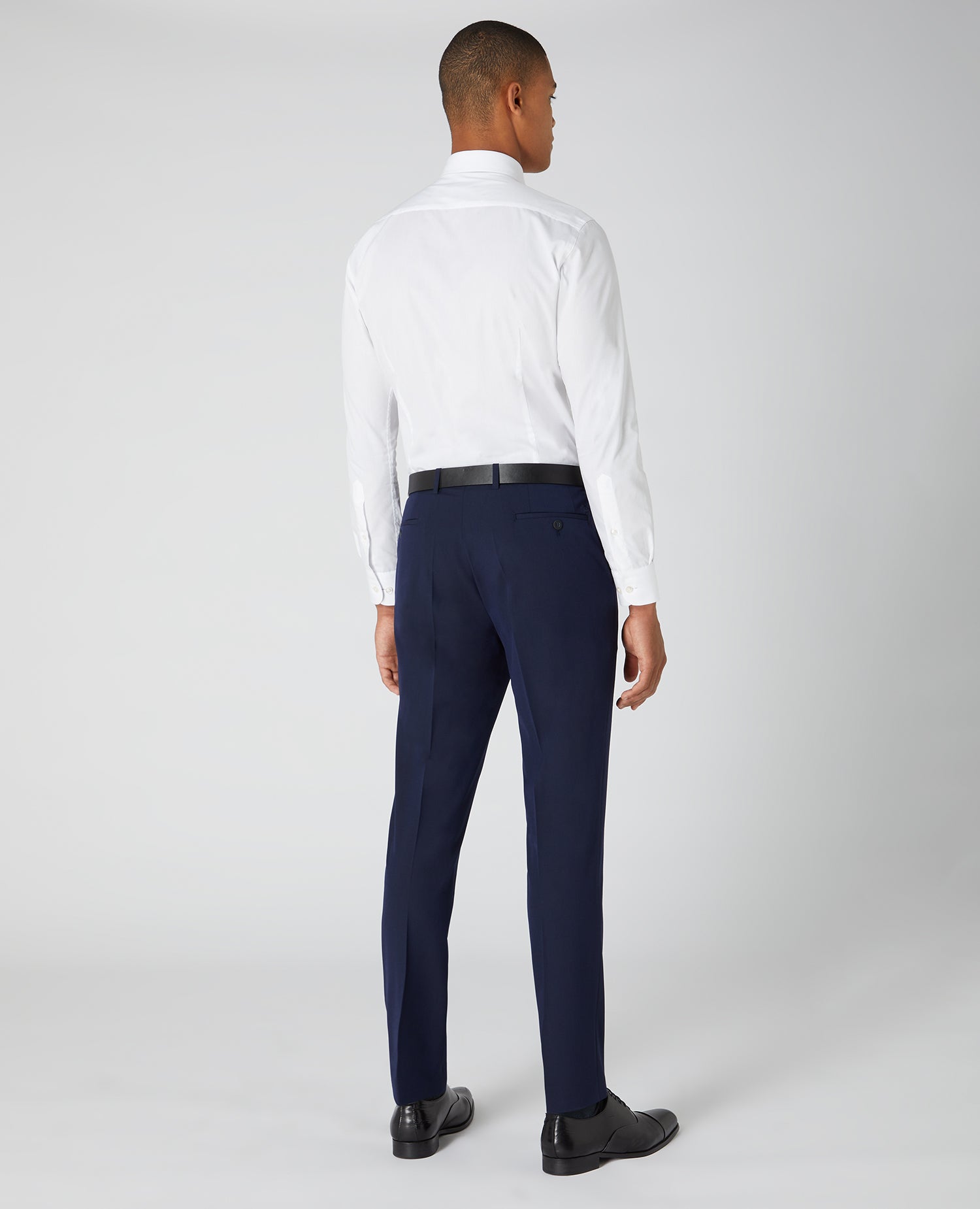 Man wearing a navy Slim Leg Formal Trousers