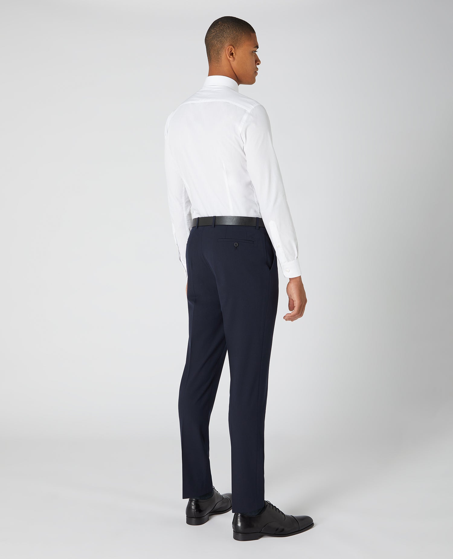 Man wearing a navy Slim Leg Formal Trousers