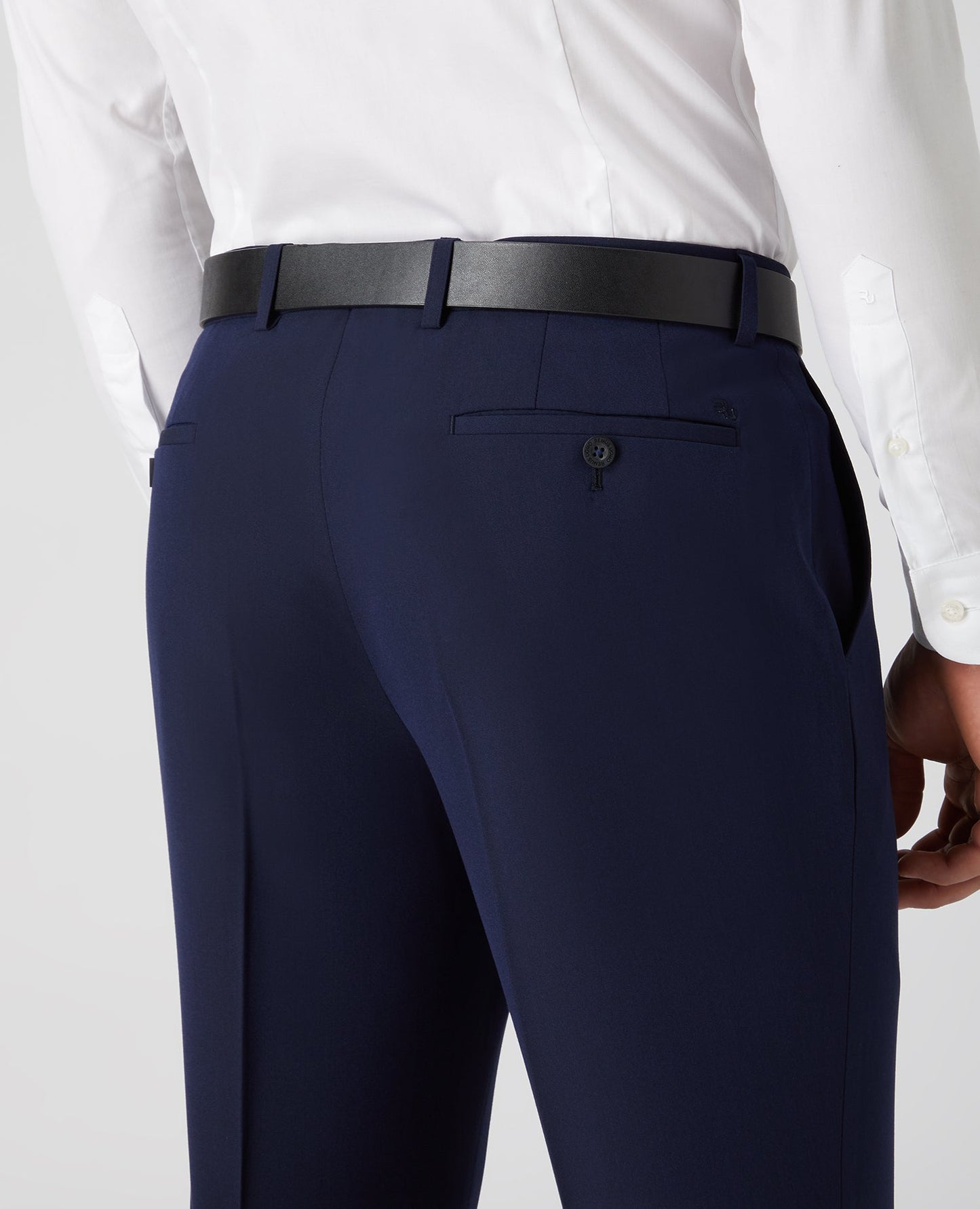 Man wearing a navy Tapered Fit Formal Trousers