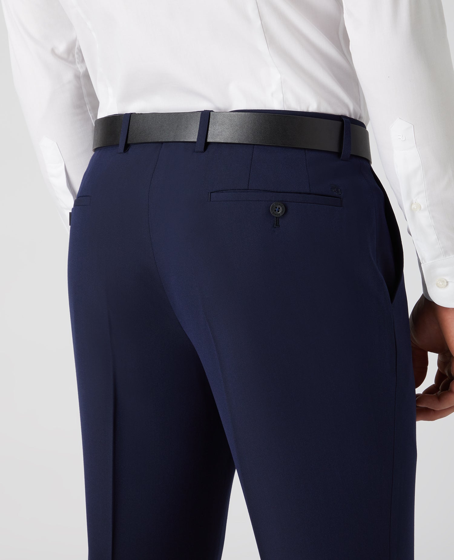 Man wearing a navy Tapered Fit Formal Trousers