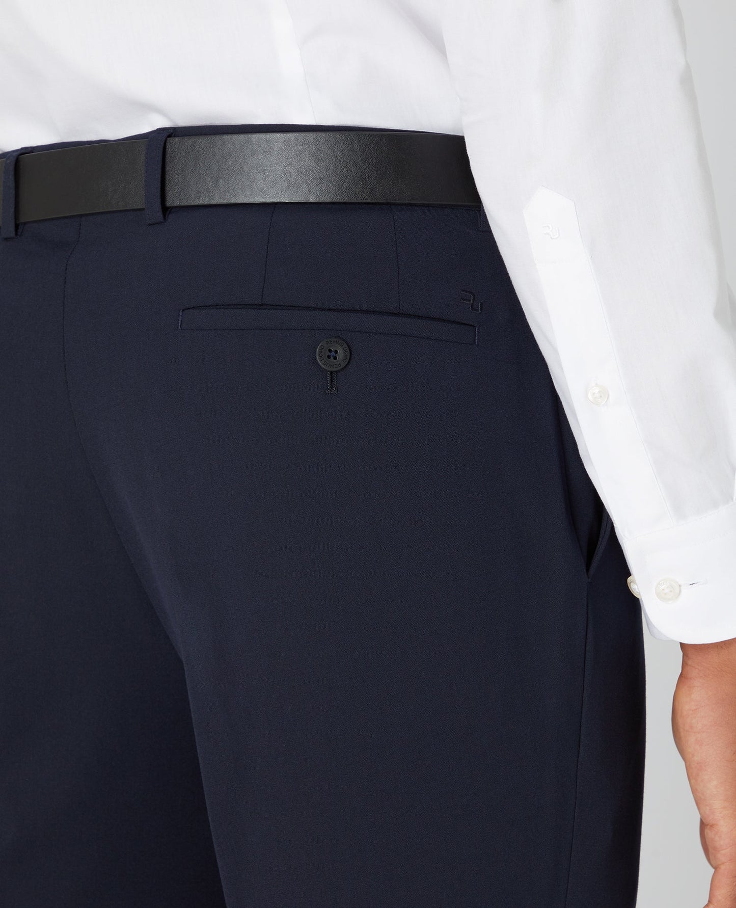 Man wearing a navy Tapered Fit Formal Trousers