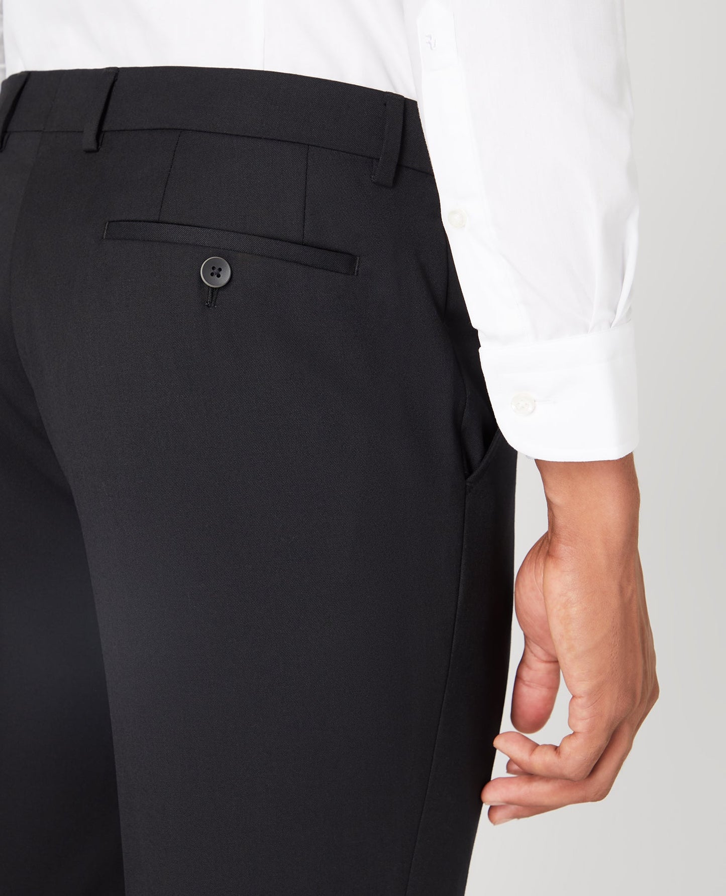 Man wearing a black Slim Fit Wool-Blend Stretch Mix and Match Trousers