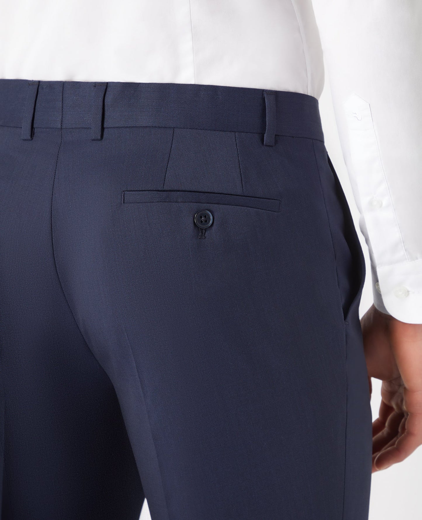 Man wearing a navy Tapered Fit Wool-Blend Stretch Mix and Match Suit Trousers