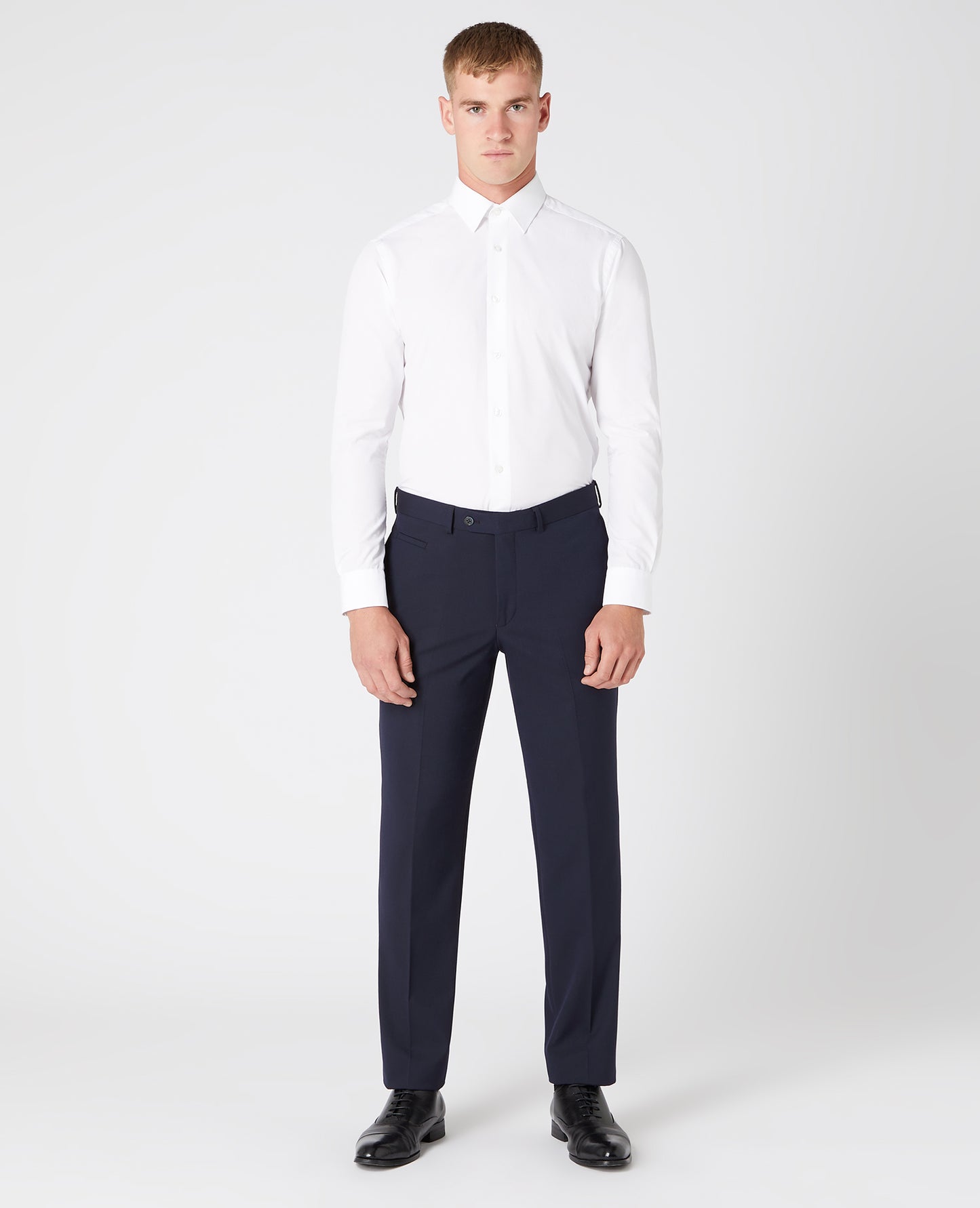 Man wearing a navy Slim Leg Stretch Formal Trousers