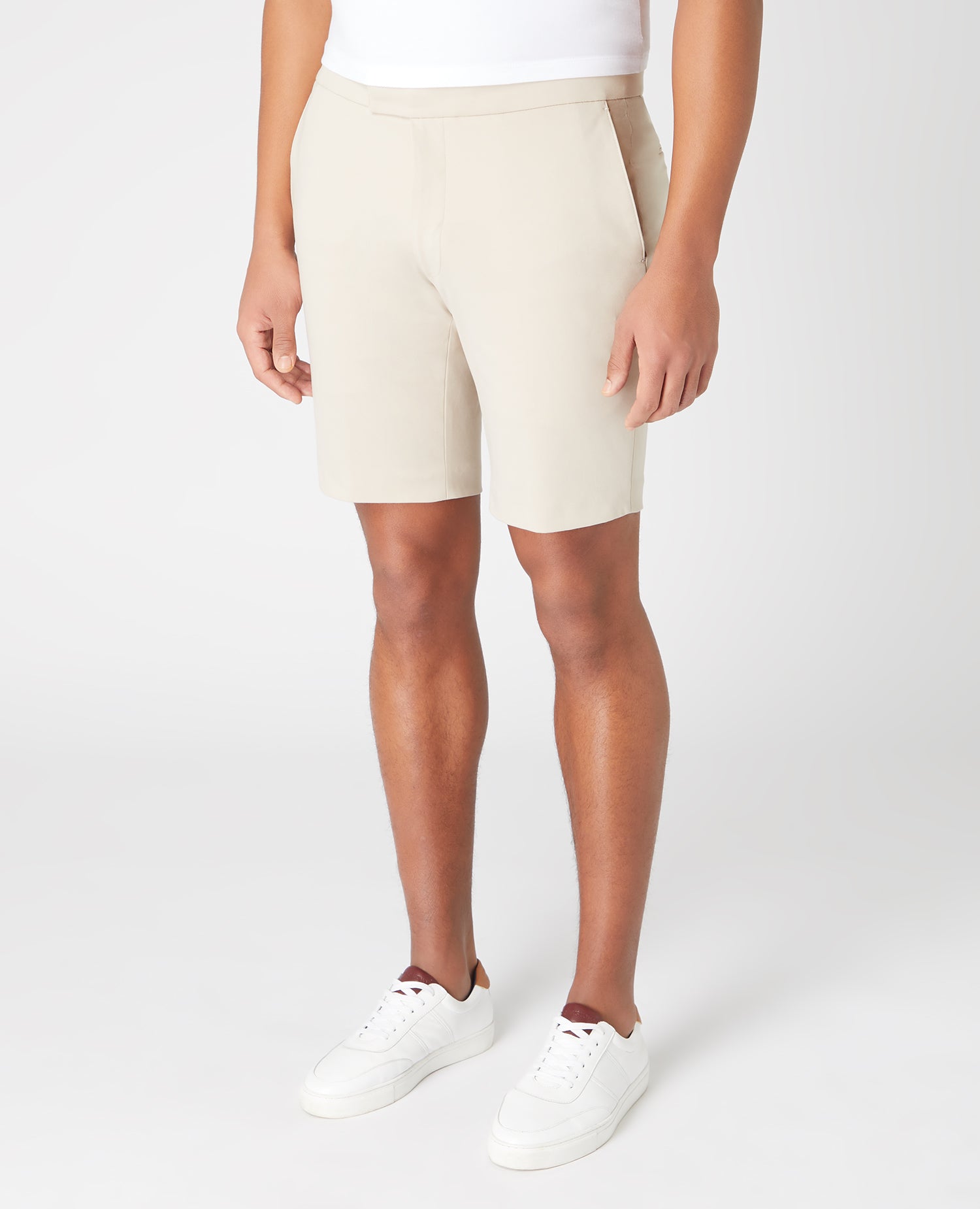 Man wearing a sand Slim Fit Cotton-Stretch Shorts