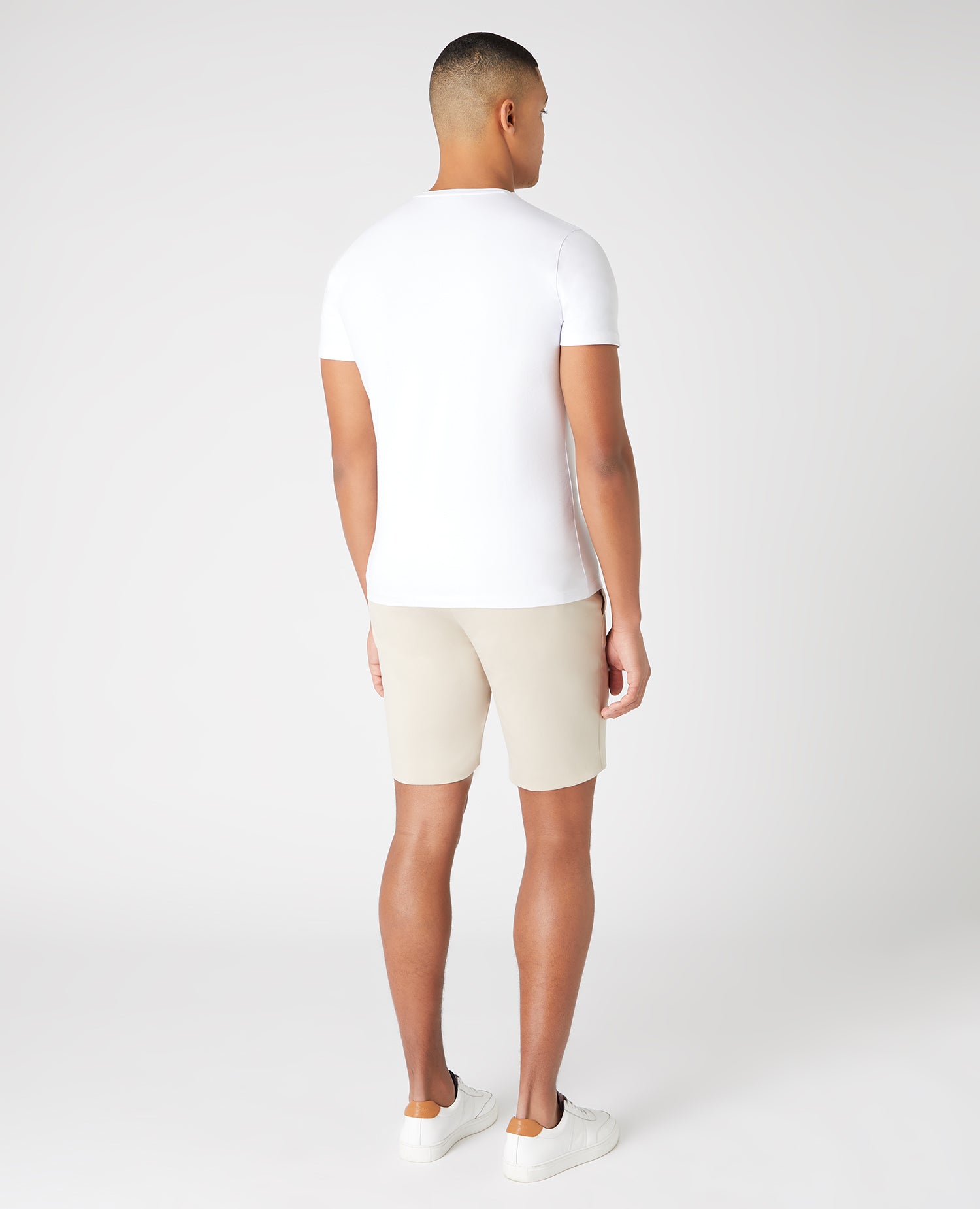 Man wearing a sand Slim Fit Cotton-Stretch Shorts